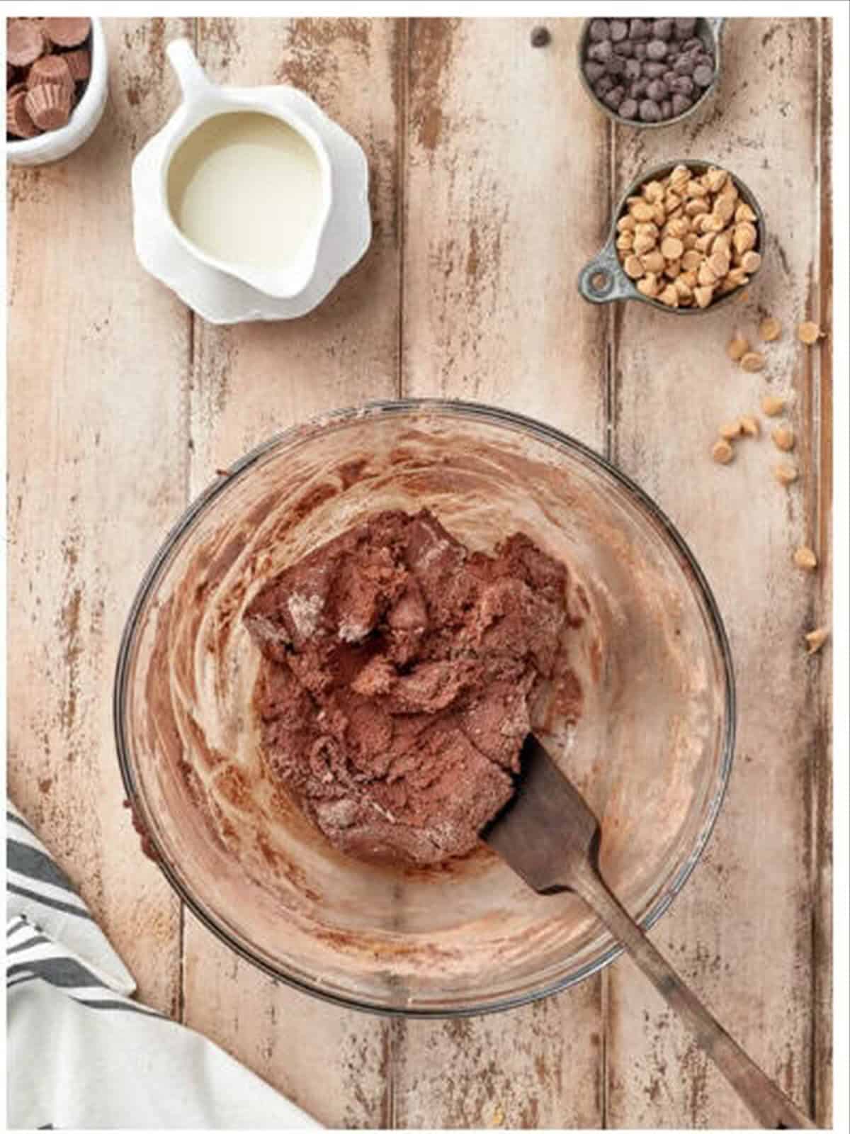 Chocolate cookie dough with chips for Reeses cookies.