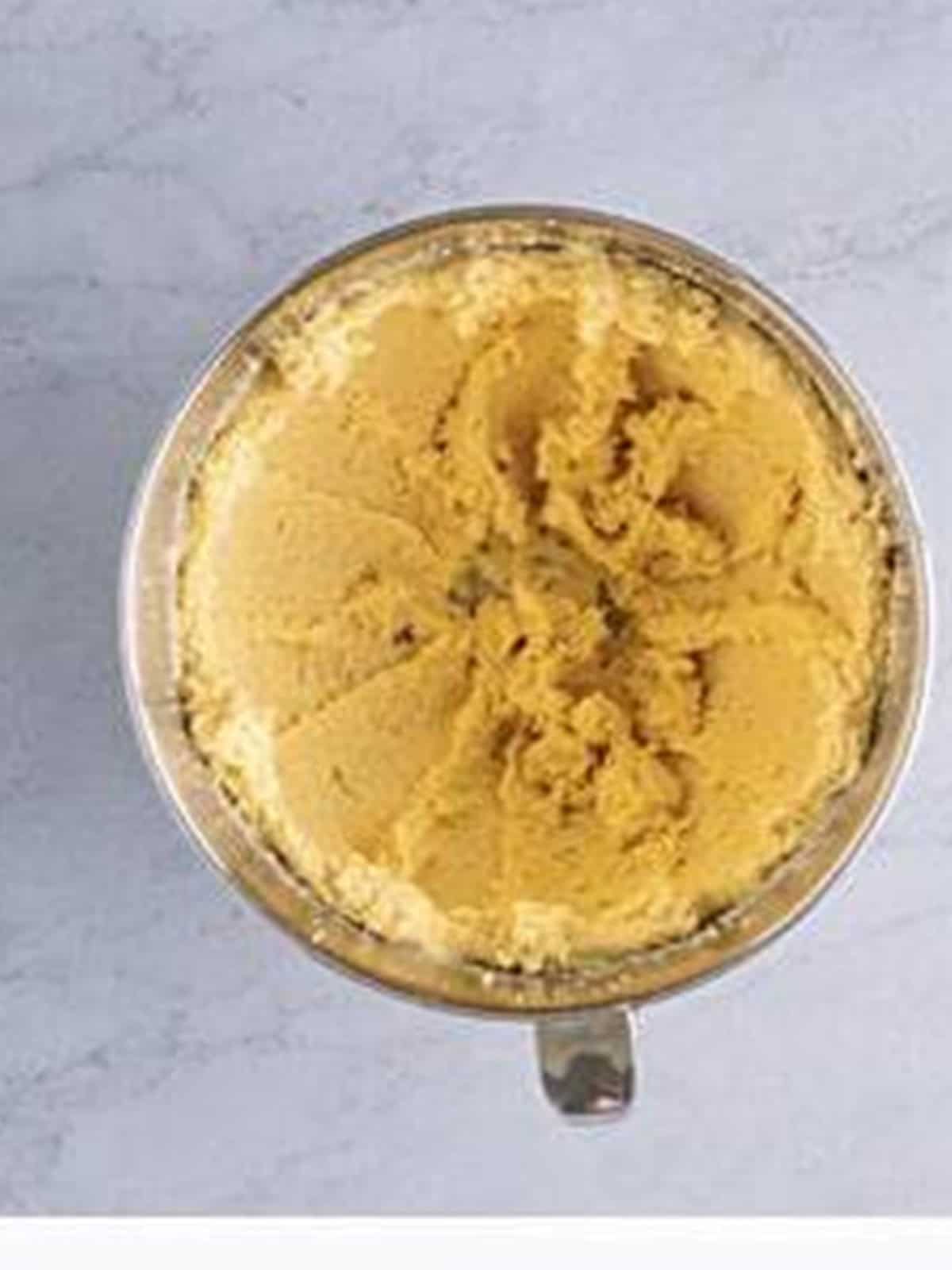 Butter and sugars creamed until smooth in a stand mixer bowl.