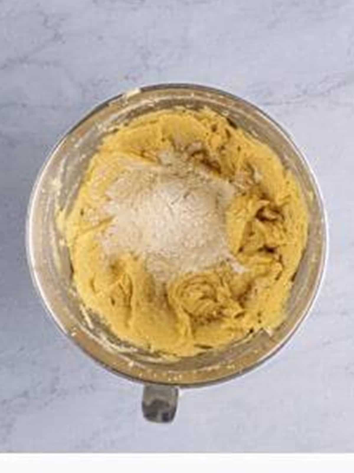 Flour mixture added a little at a time to the cookie dough.