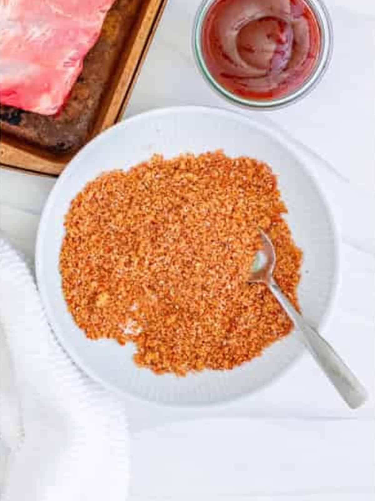 Brown sugar and spice rub mixed in a bowl for slow cooker ribs.