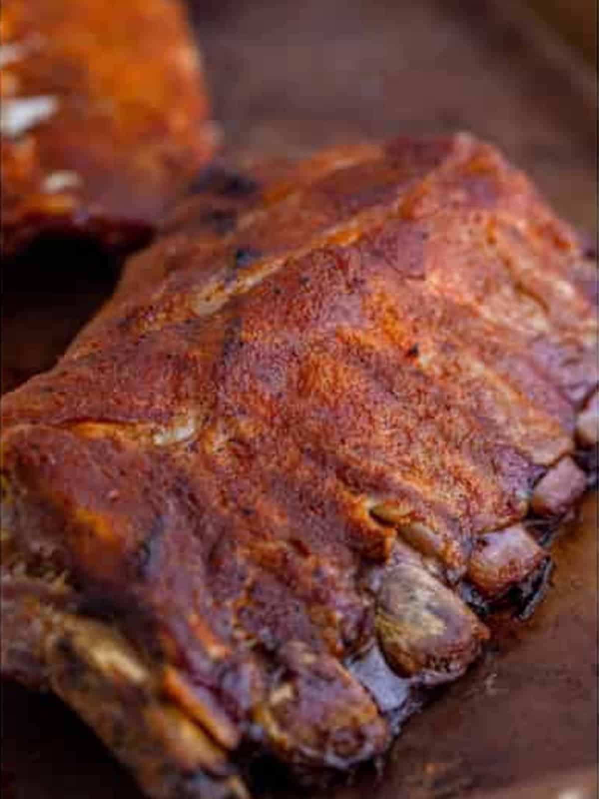 Tender slow cooked baby back ribs after cooking low and slow.
