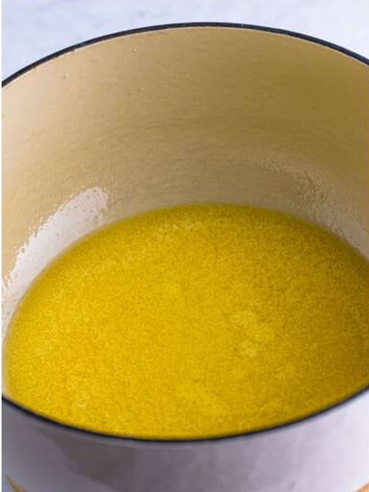 Butter melting in a large pot to start Rice Krispie Treats.