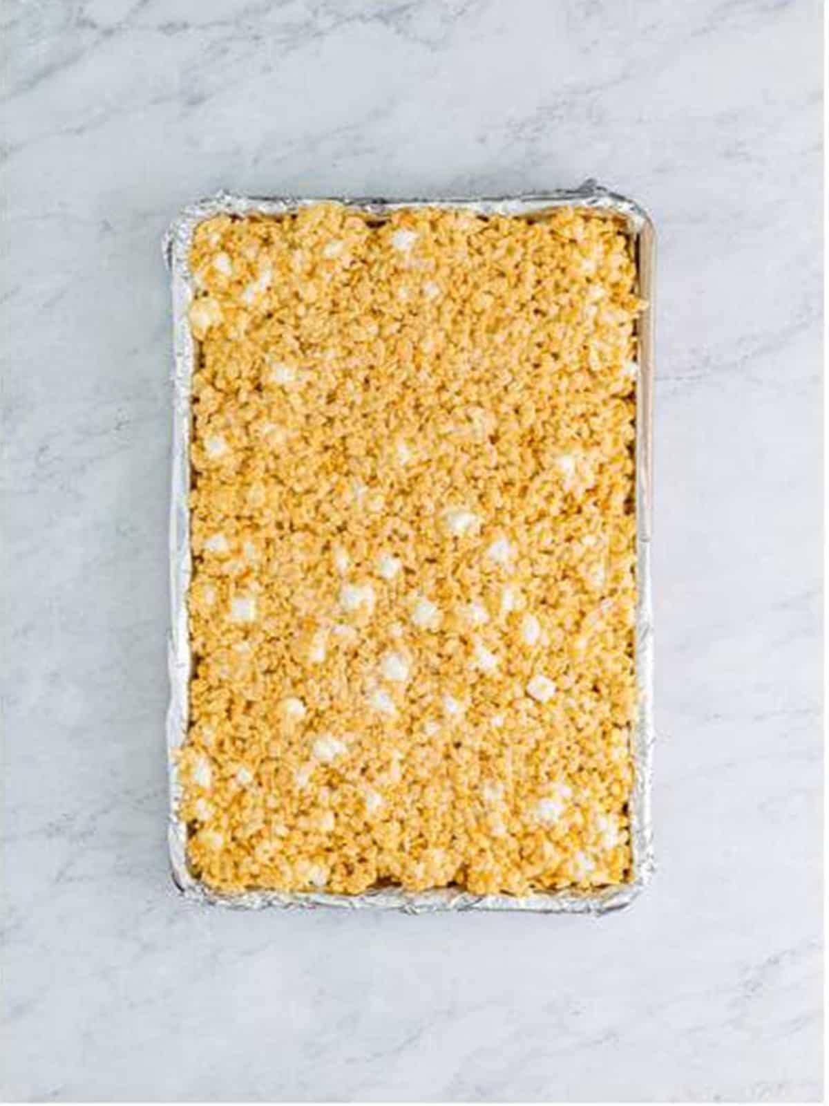 Finished pan of Rice Krispie Treats ready to cut into bars.