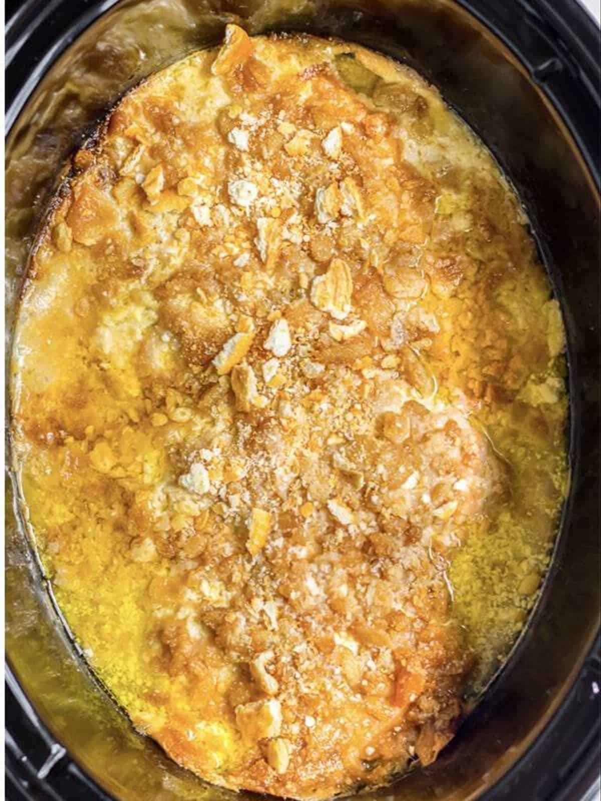 Cooked creamy Ritz cracker chicken in the slow cooker.