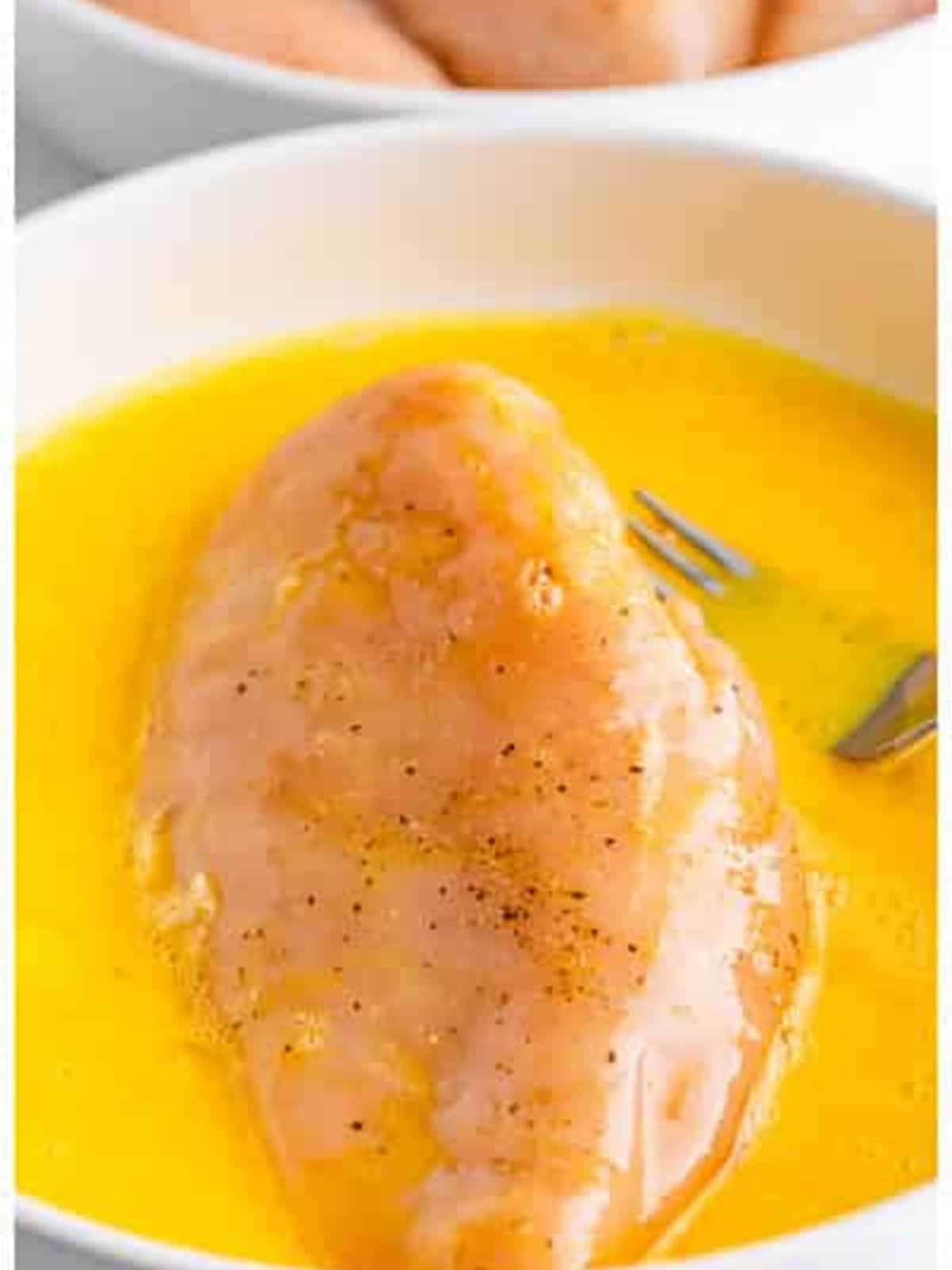 Dipping chicken in egg for Ritz cracker chicken.