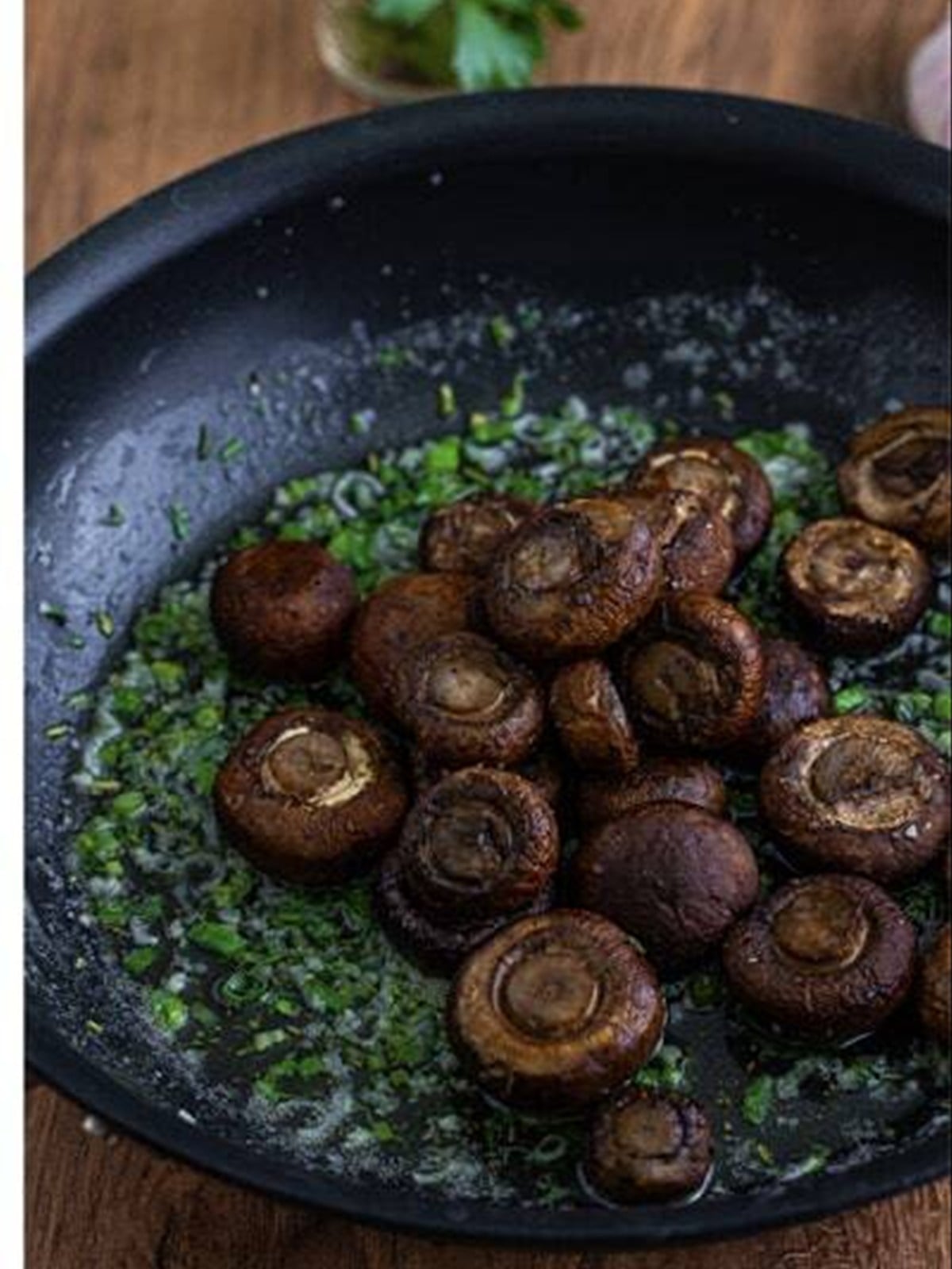 Roasted mushrooms added to the garlic butter skillet.