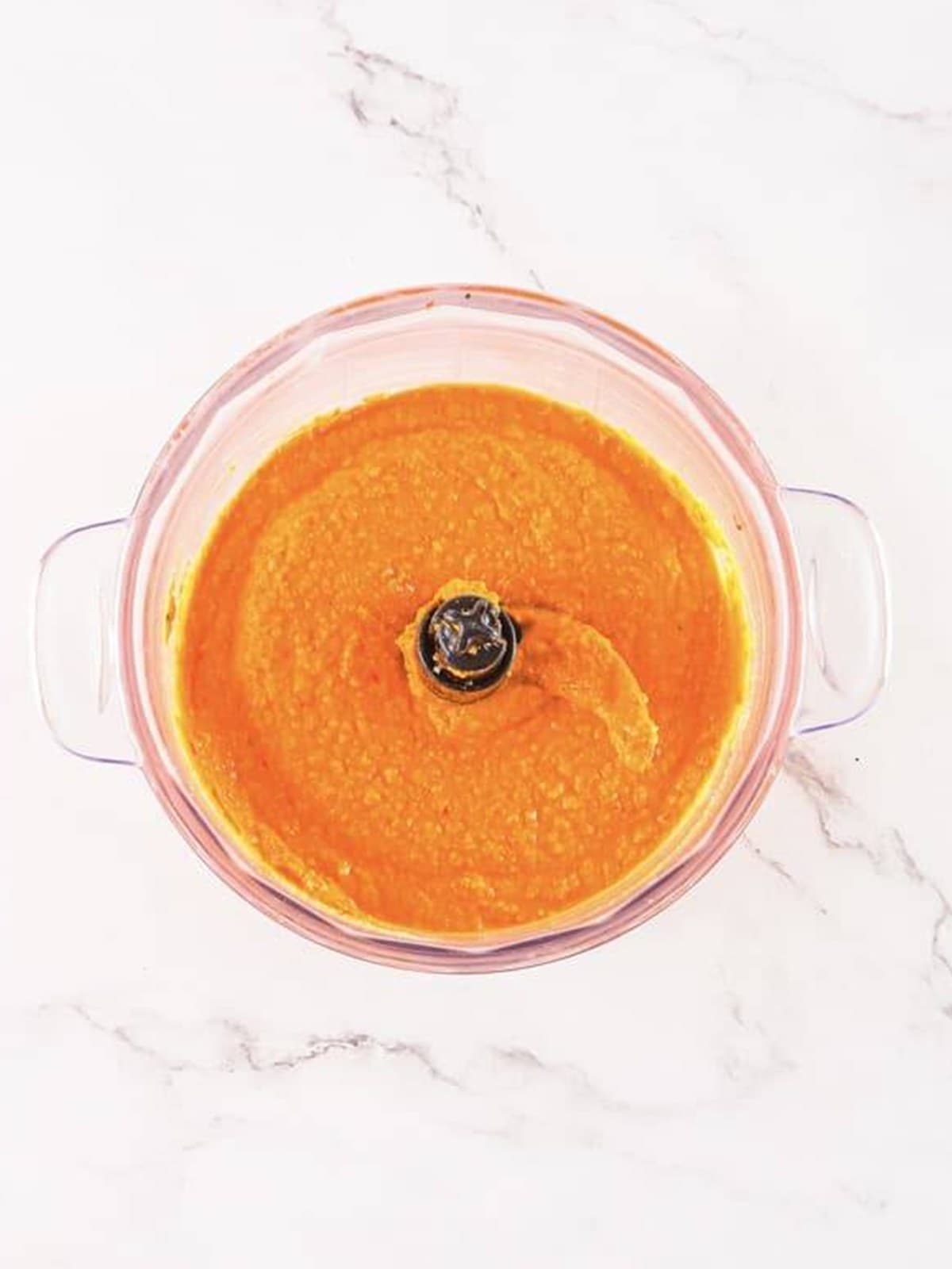 Smooth, creamy blended roasted red pepper hummus in the blender.