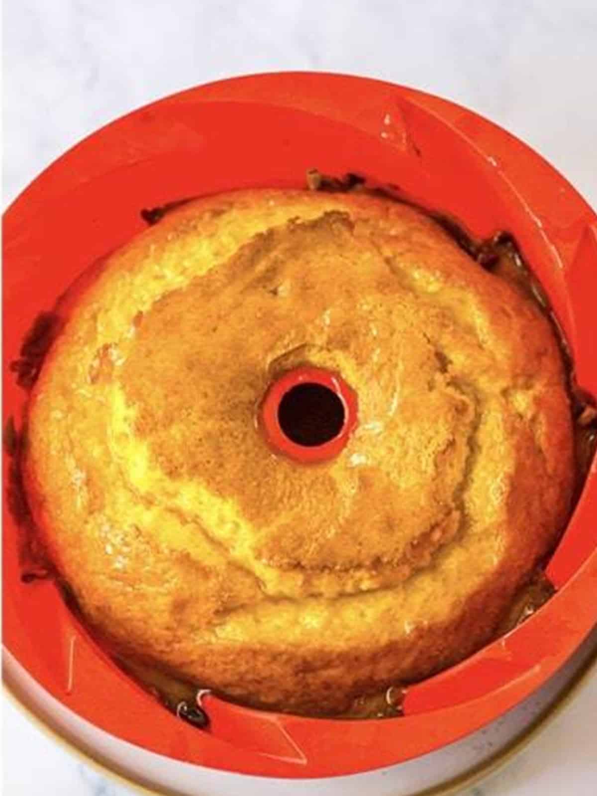 Baked rum cake in the bundt pan ready to be glazed.