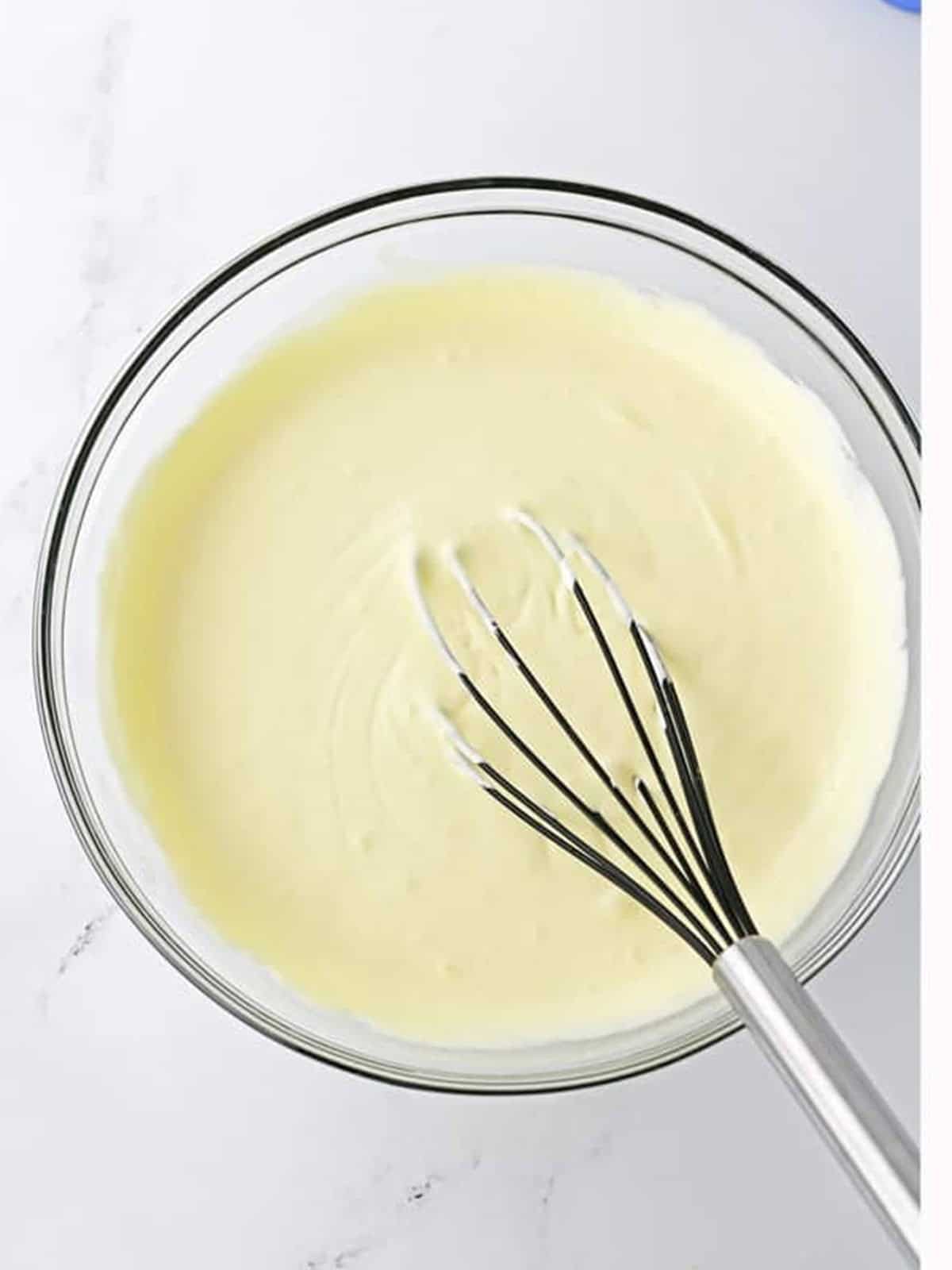 Pudding shot mixture whisked smooth with vodka, caramel syrup, and whipped topping.