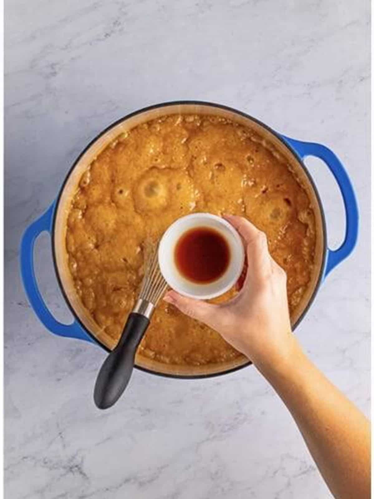 Heavy cream slowly streamed into the boiling caramel.