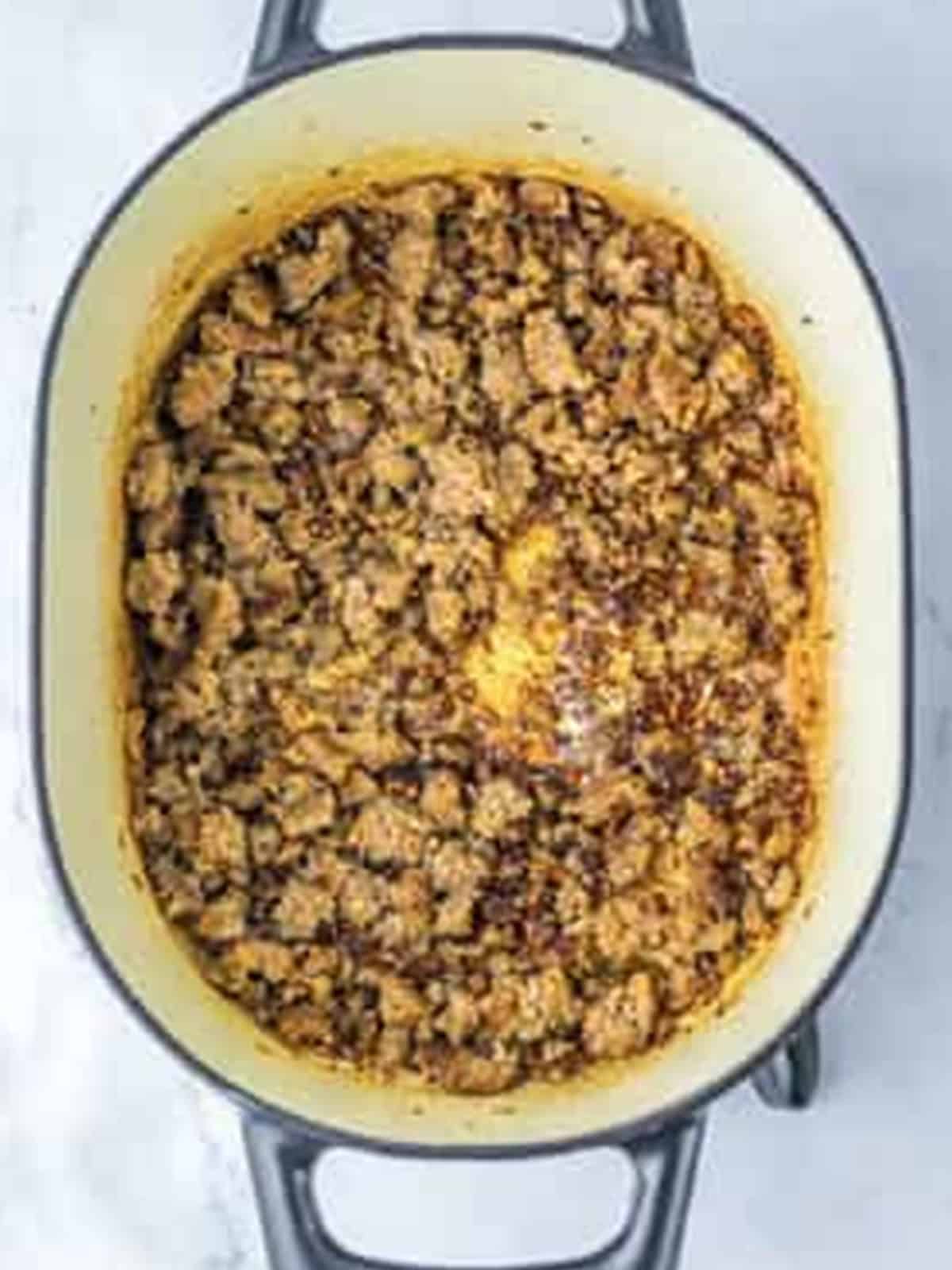 Browned Italian sausage in a large soup pot.