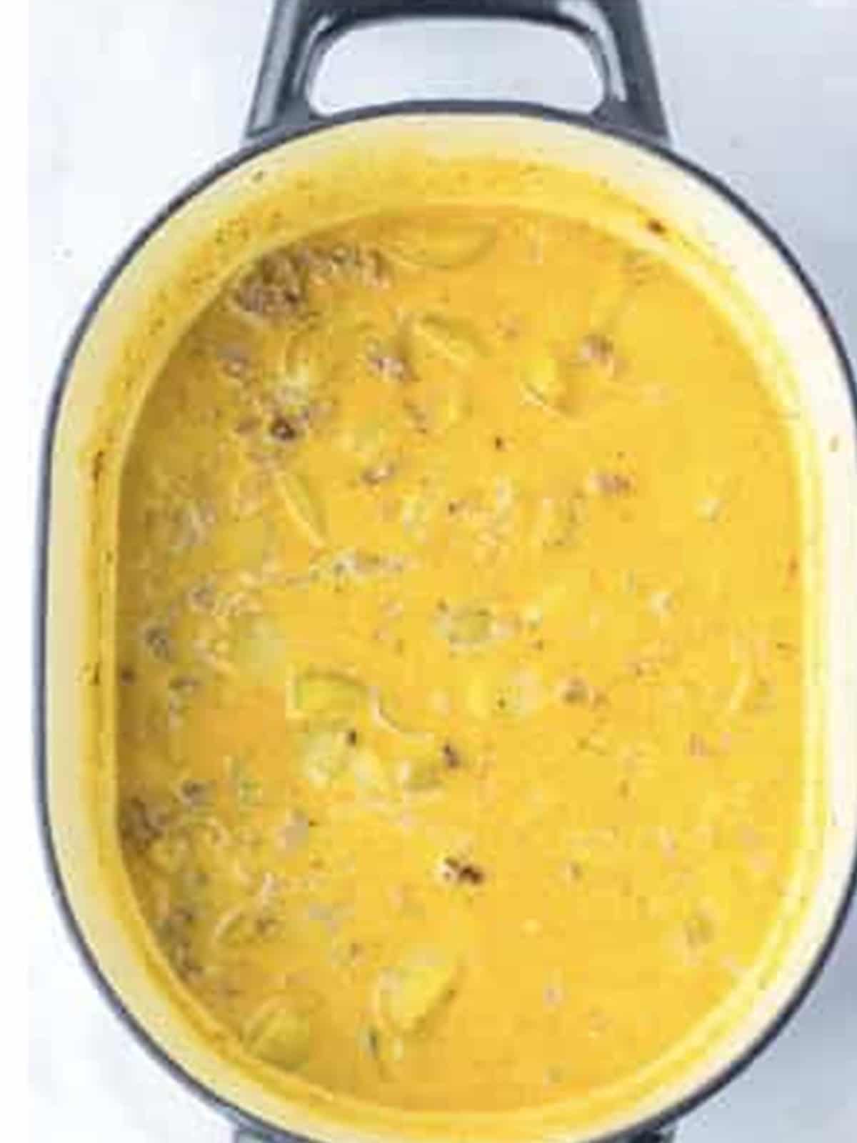 Finished creamy sausage potato soup in a dutch oven.