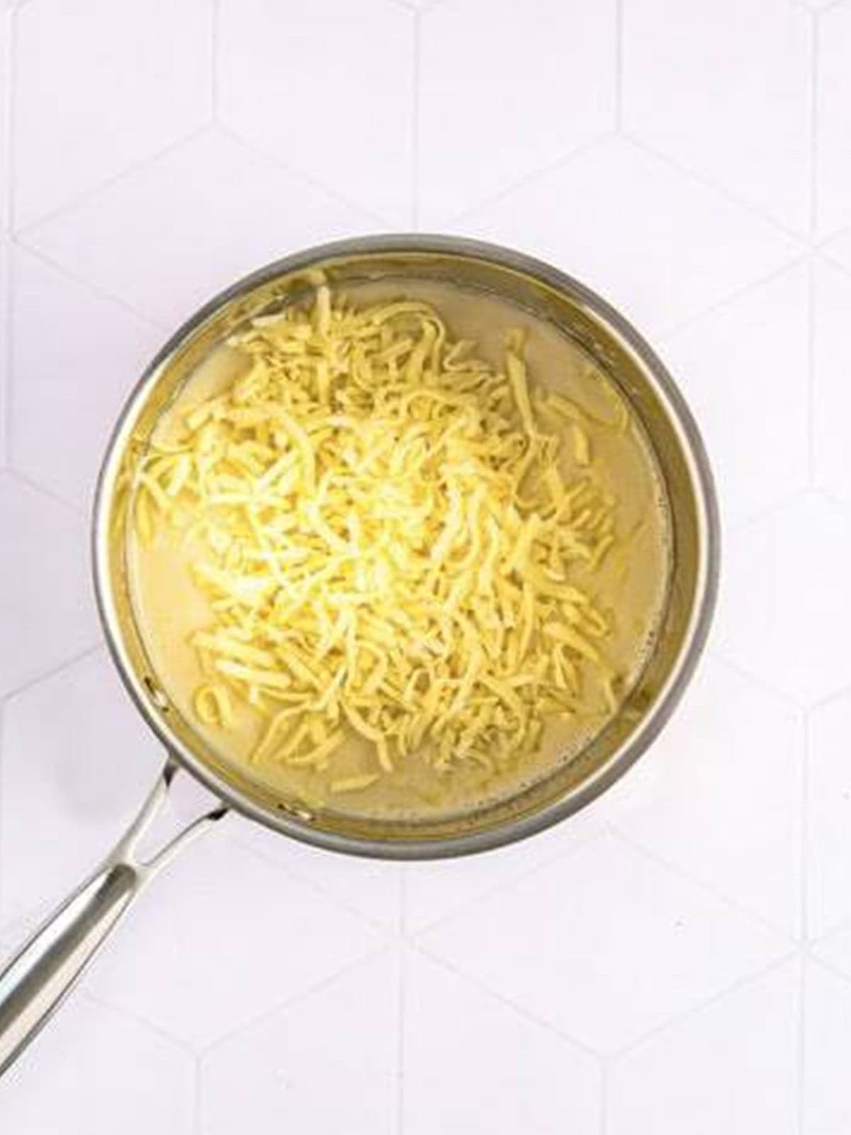 Shredded Italian cheese stirred into the white sauce to make a cheese sauce.