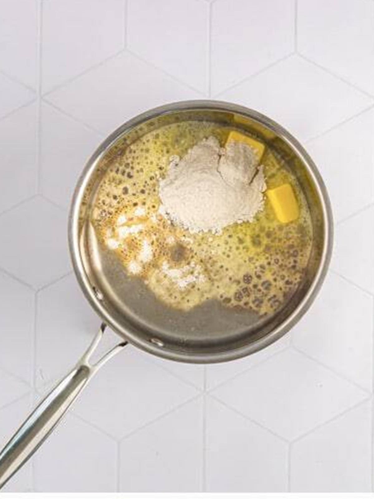 Butter and flour cooked together into a roux in a saucepan.
