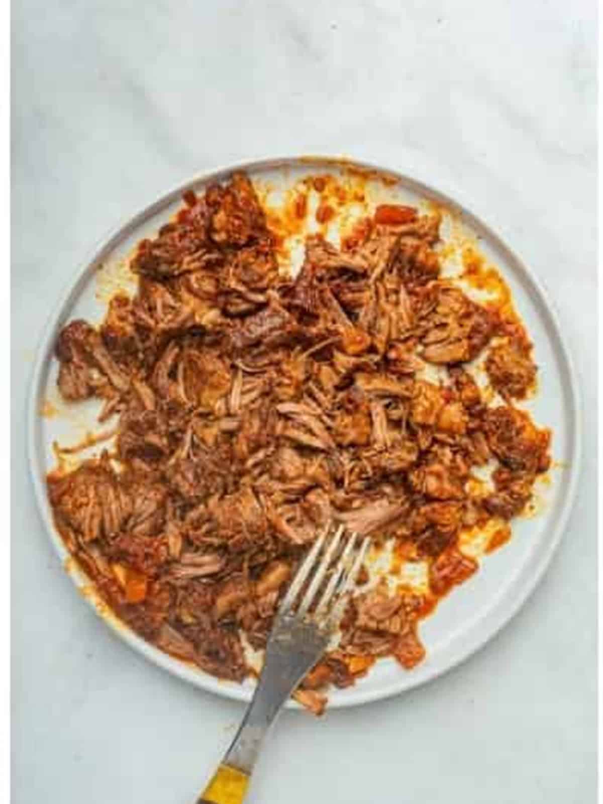 Tender short rib meat shredded with two forks to stir back into the ragu.