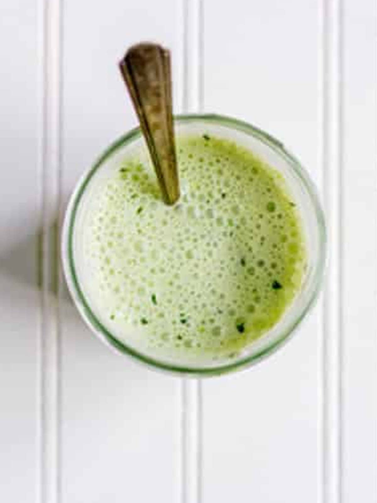 Creamy cilantro lime sauce blended in a glass for shrimp tacos.