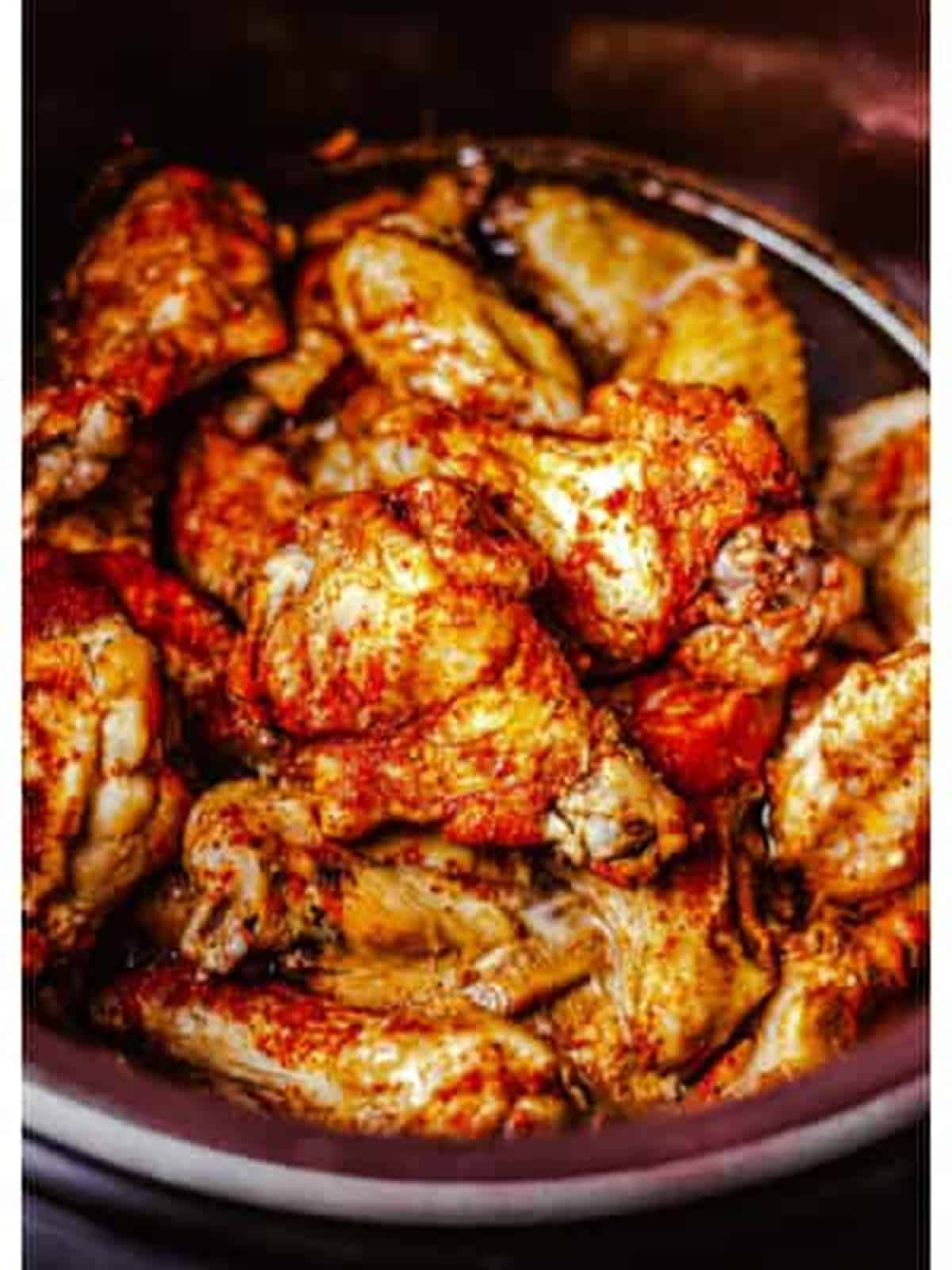 Slow cooked chicken wings in the slow cooker for BBQ chicken wings.