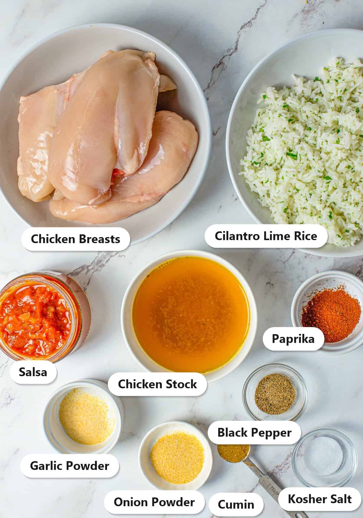 Labeled ingredients for slow cooker chicken burritos including chicken breasts, cilantro lime rice, salsa, chicken stock, and seasonings.