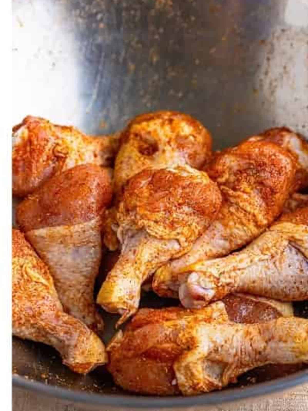 Chicken drumsticks tossed in the dry rub for smoked chicken legs.