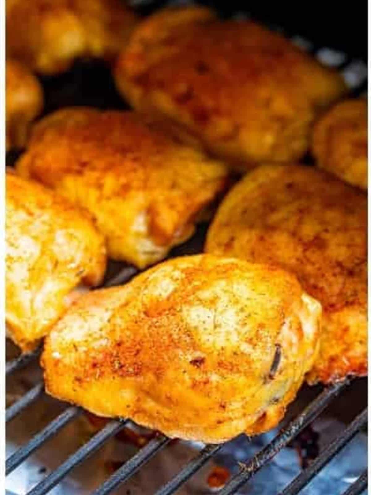 Smoked chicken thighs cooked through on the smoker.