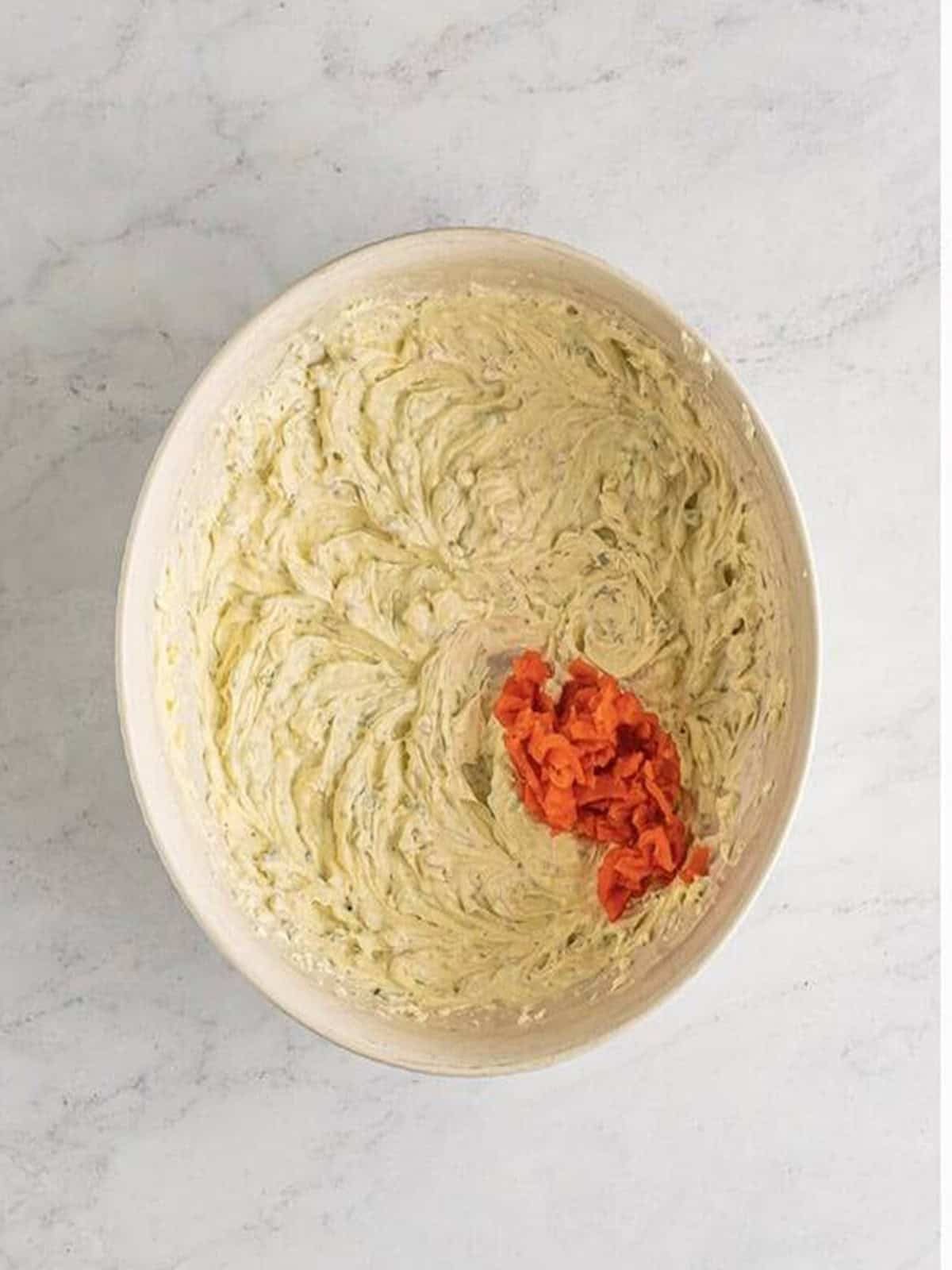 Chopped smoked salmon added to the creamy dip before folding it in.