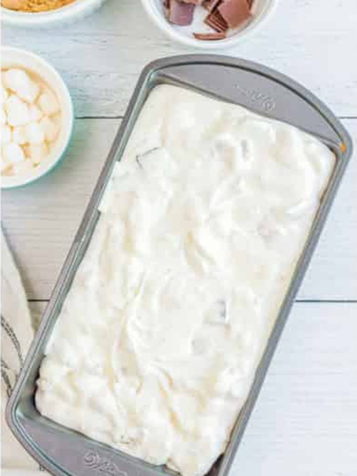 Smores ice cream mixture poured into a loaf pan.
