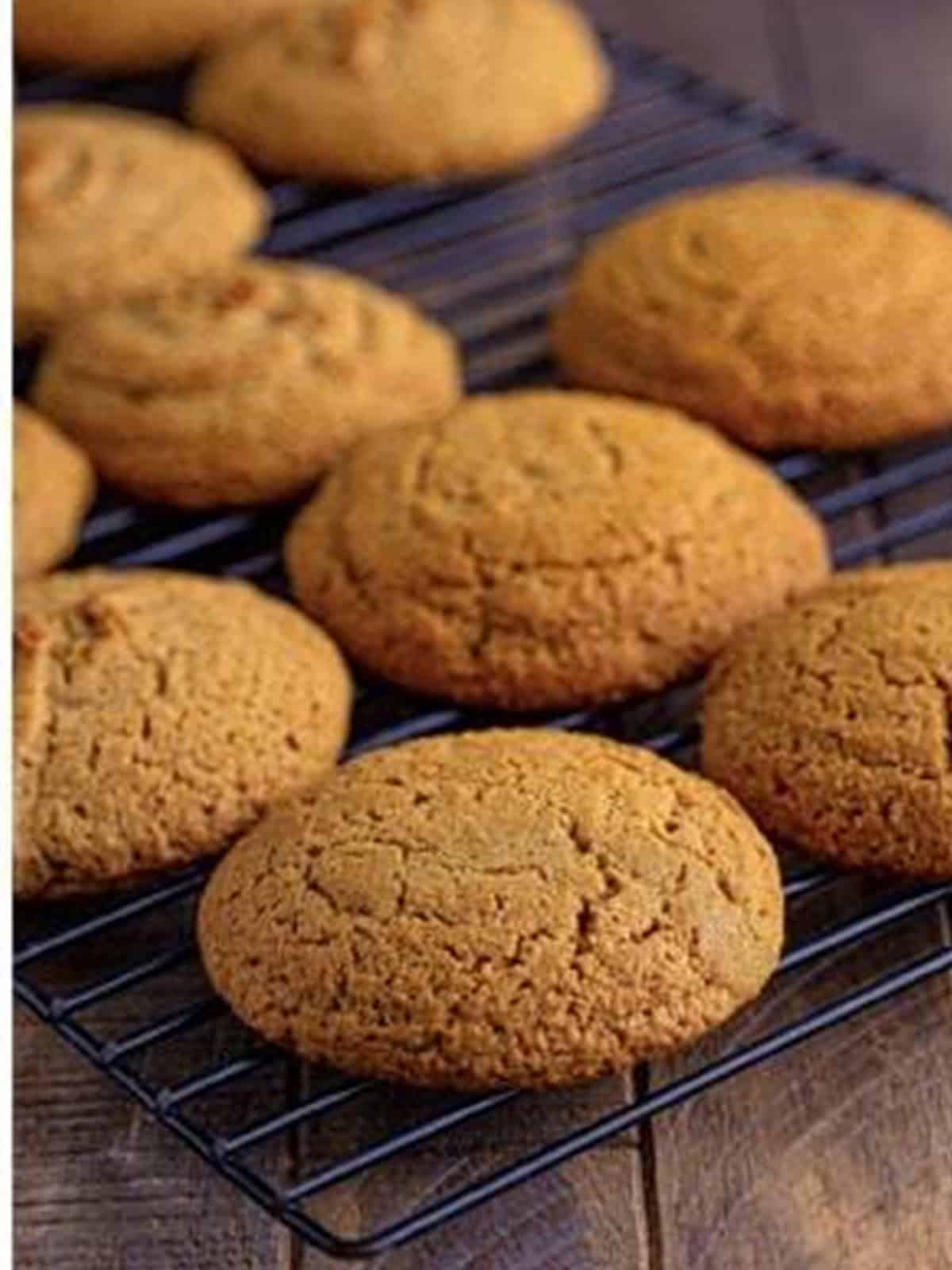 Baked graham cracker whoopie pie cookies cooling on a wire rack.
