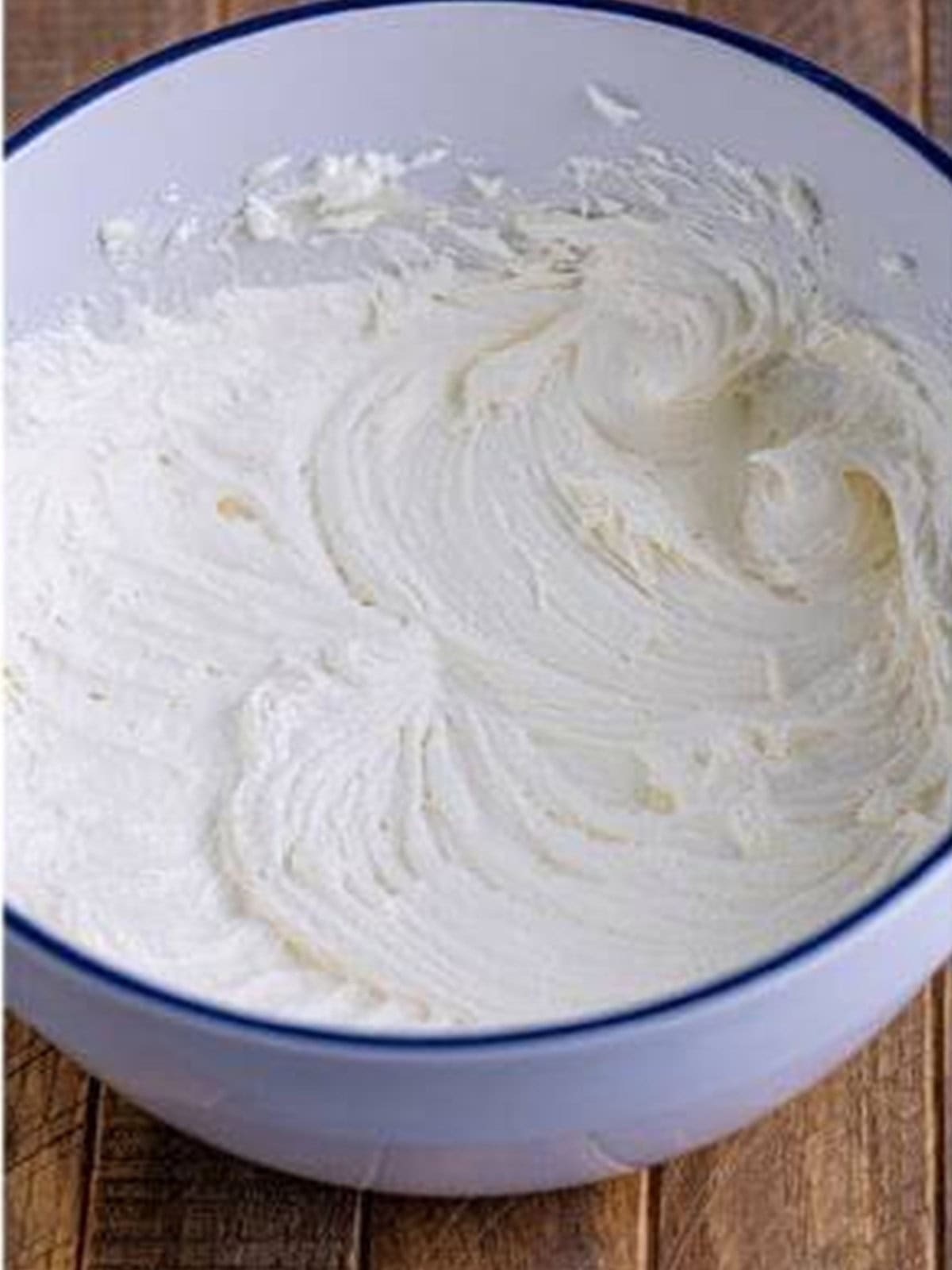 Smooth marshmallow buttercream filling whipped in a bowl.