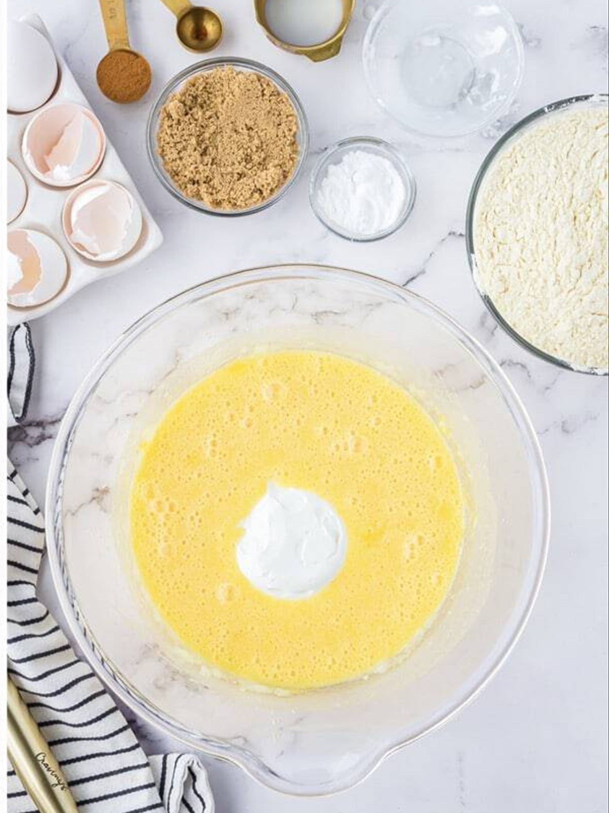 Smooth snickerdoodle cake batter in a glass bowl.