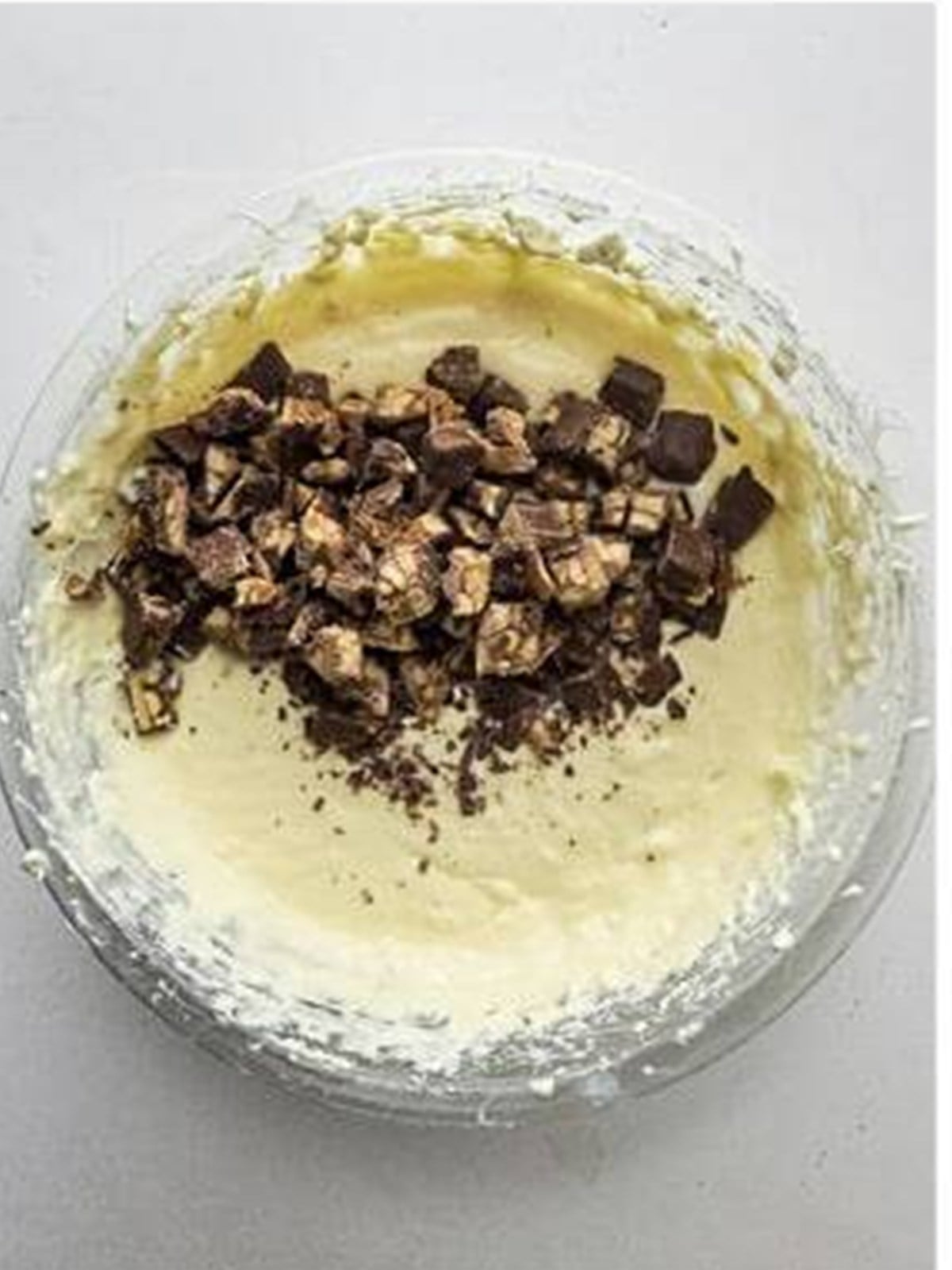 Chopped Snickers bars folded into the cheesecake batter.