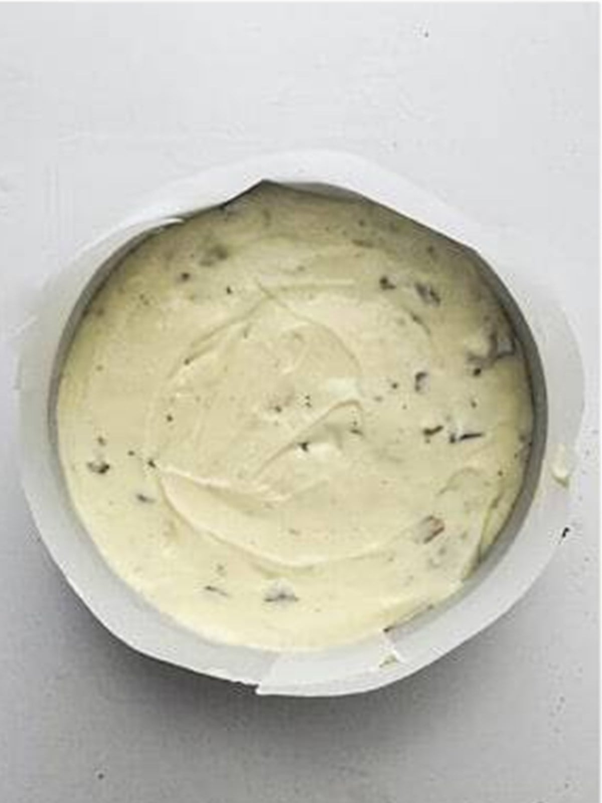 Snickers cheesecake batter poured smooth into the springform pan.