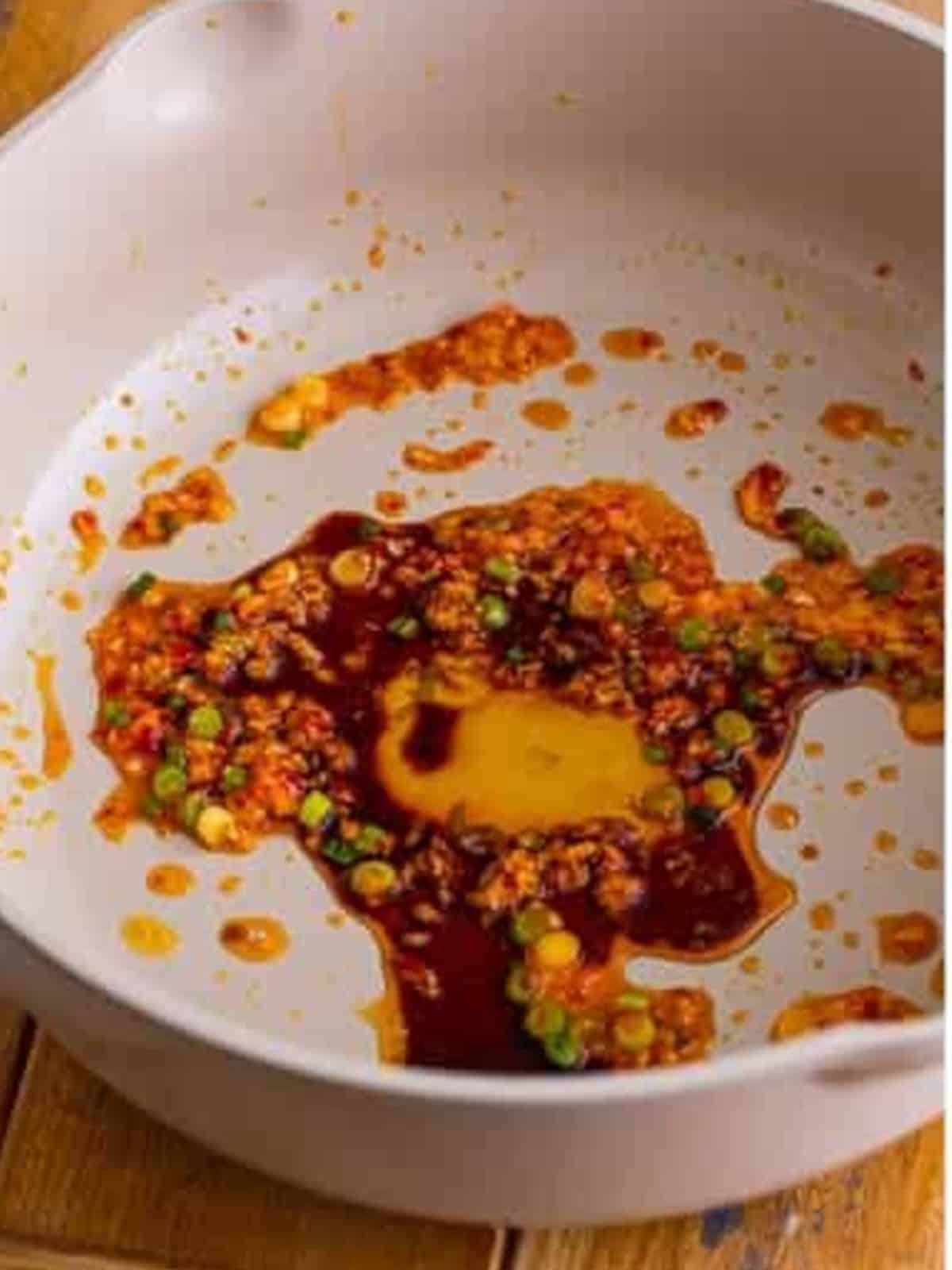 Soy sauce and honey added to the aromatics in the pan for the snow peas recipe sauce.