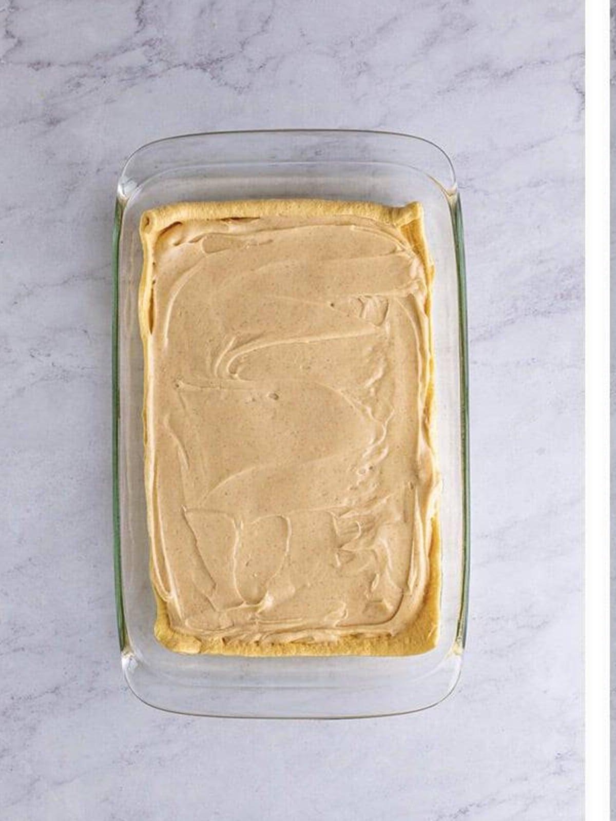 Cheesecake filling spread evenly over the bottom crescent layer.