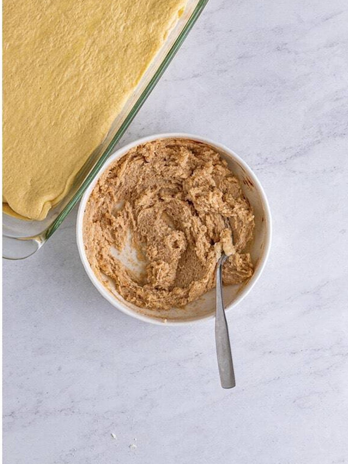 Melted butter, sugar, and cinnamon mixed into a cinnamon sugar topping.