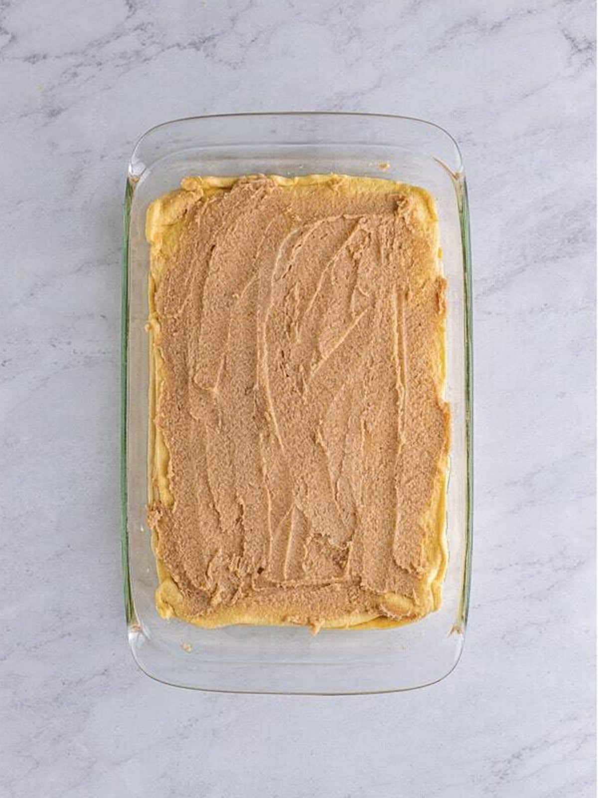 Cinnamon sugar topping spread over the top crescent layer before baking.