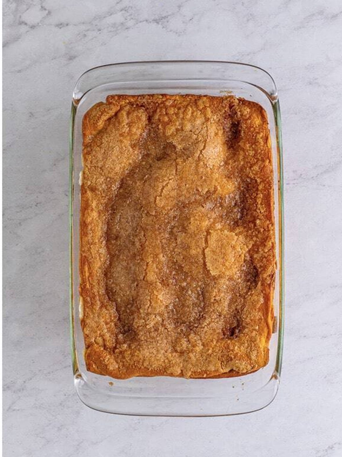 Golden baked sopapilla cheesecake bars with a cinnamon sugar crust.