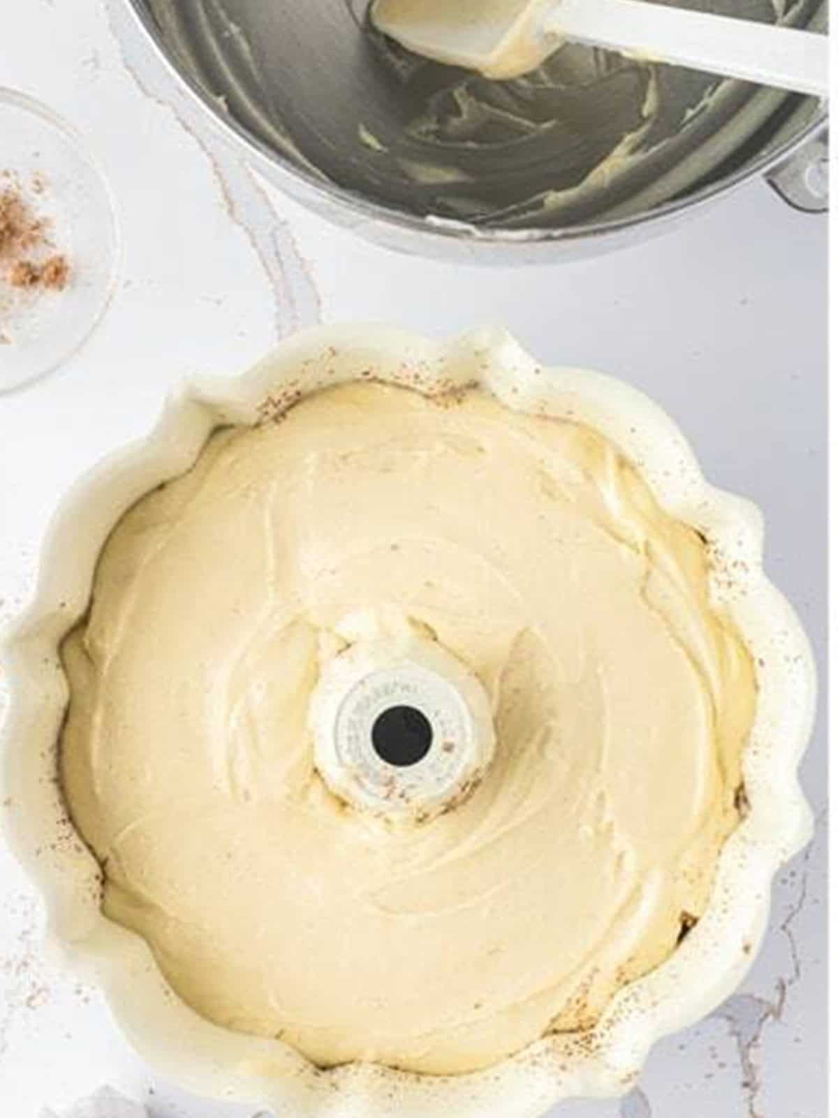 Final layer of batter smoothed on top before baking the bundt coffee cake.