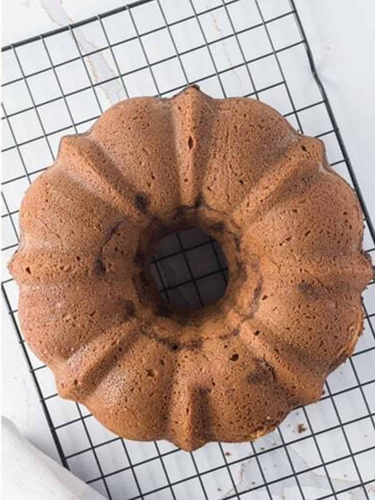 Bundt coffee cake flipped out of the pan onto a wire rack to cool completely.
