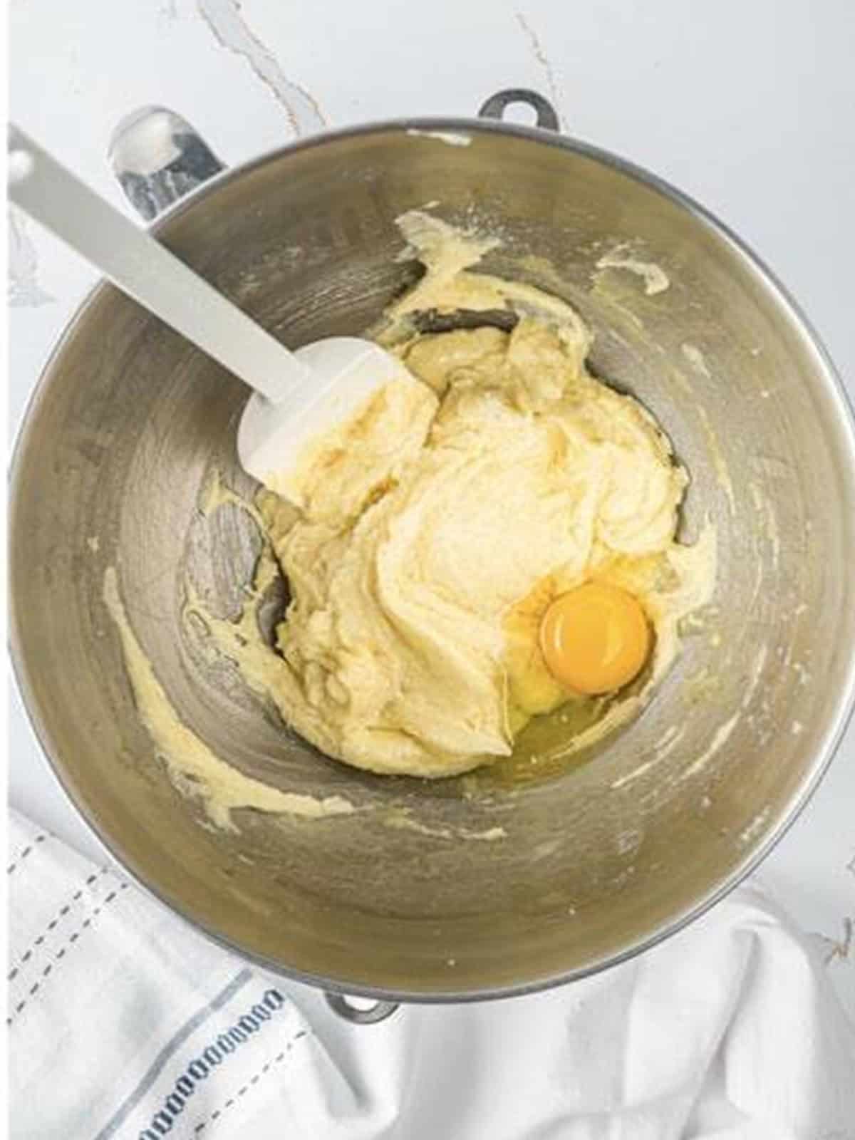 Extracts and eggs added one at a time to the creamed butter mixture.
