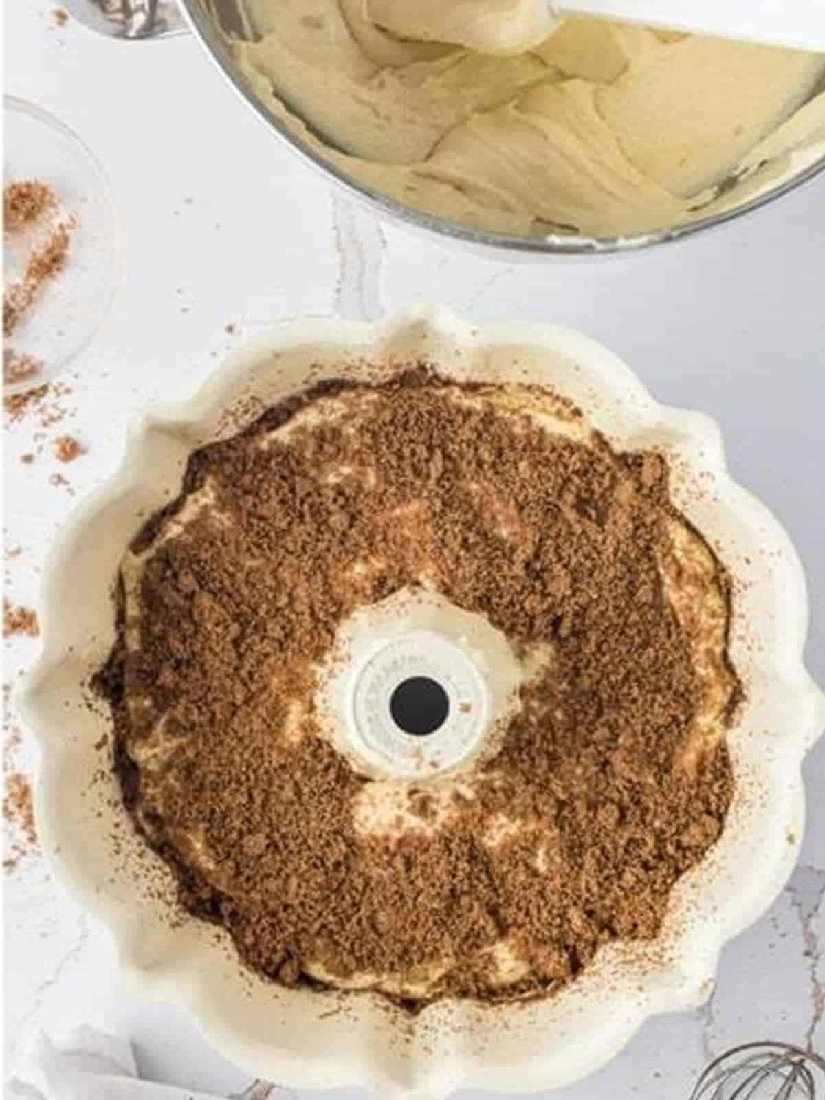 Remaining cinnamon sugar filling sprinkled over the batter in the bundt pan.