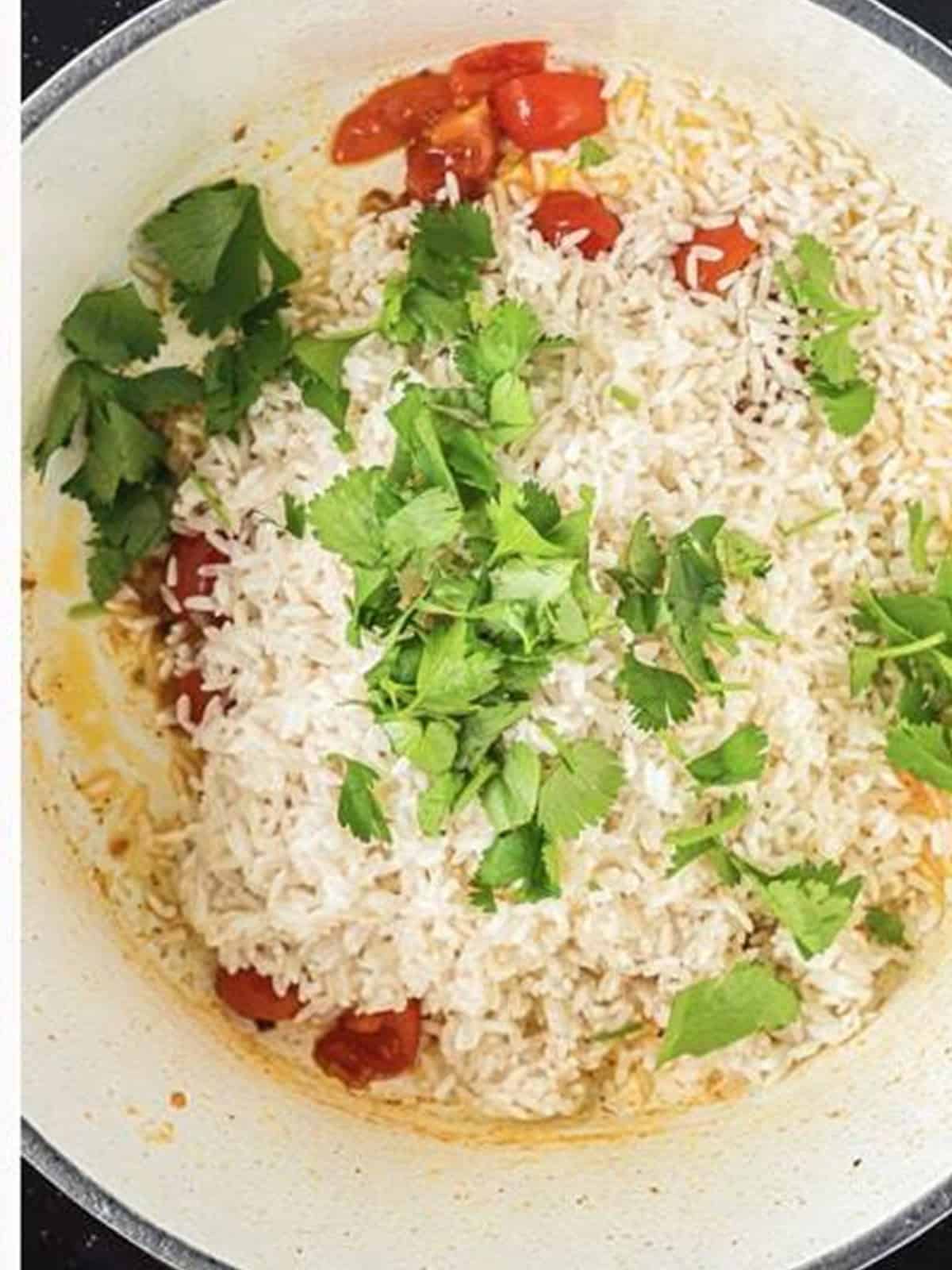 Adding rice and chopped cilantro to the skillet for Spanish Rice.