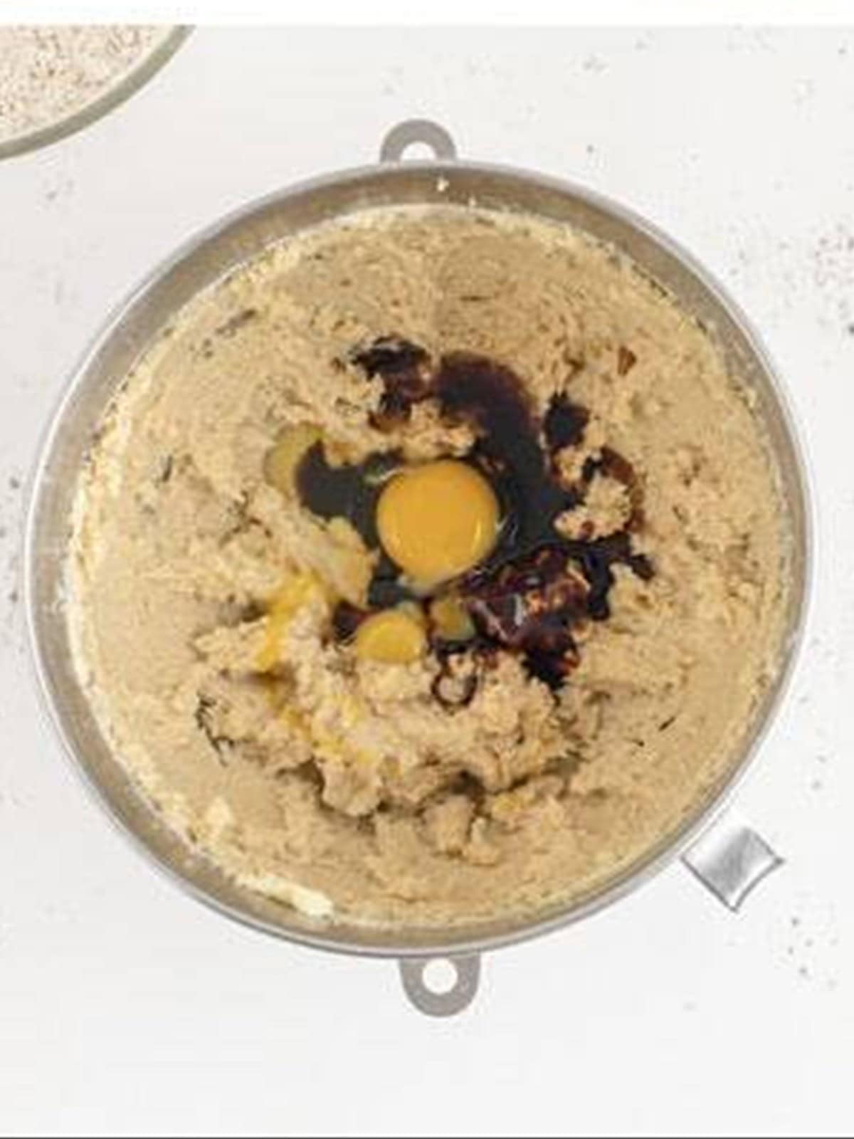 Eggs, molasses, and vanilla added to the creamed butter.