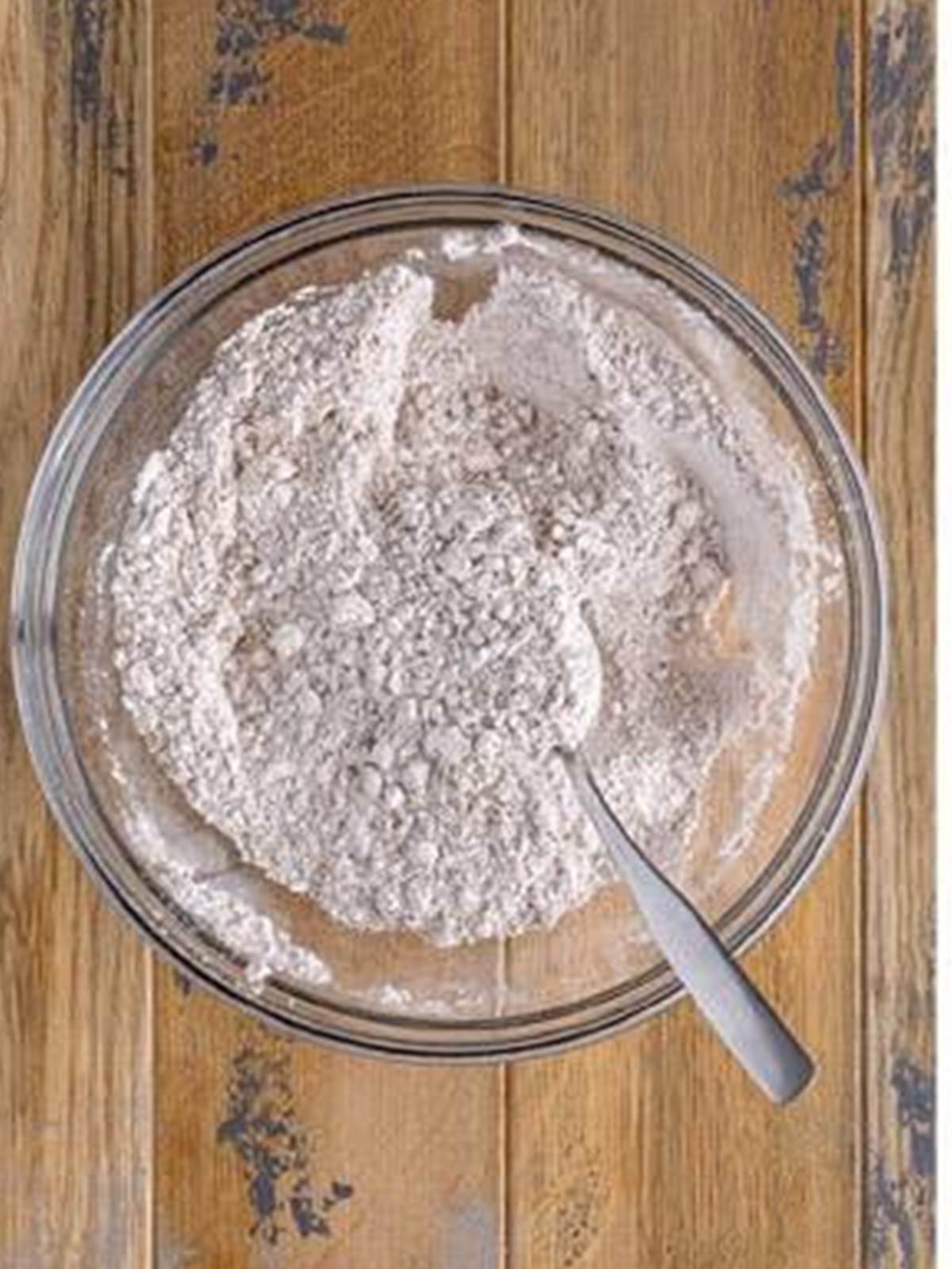 Cake flour and warm spices whisked together in a bowl.