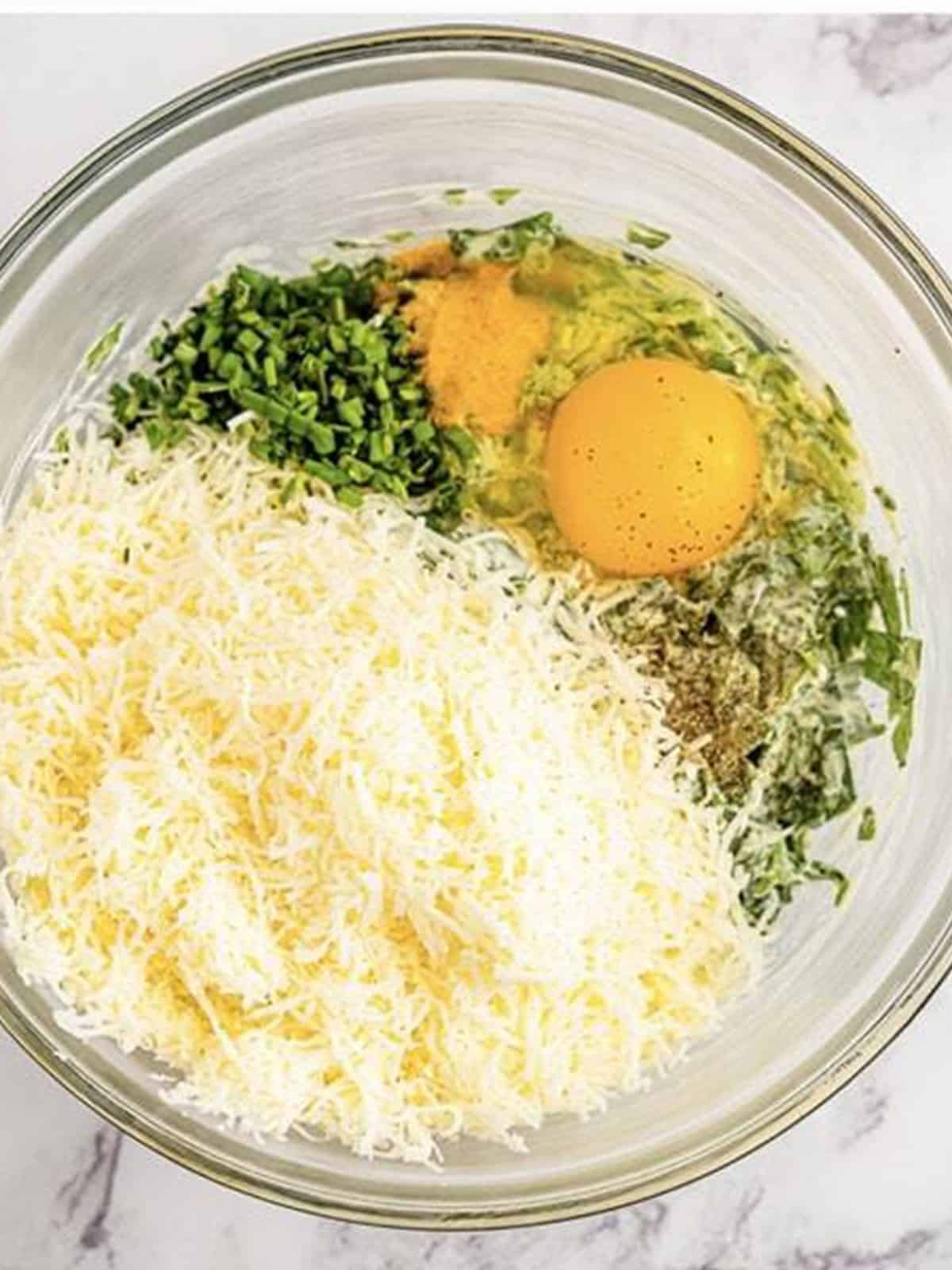 Mozzarella, Parmesan, egg, scallions, and seasonings added to the spinach and cream cheese.