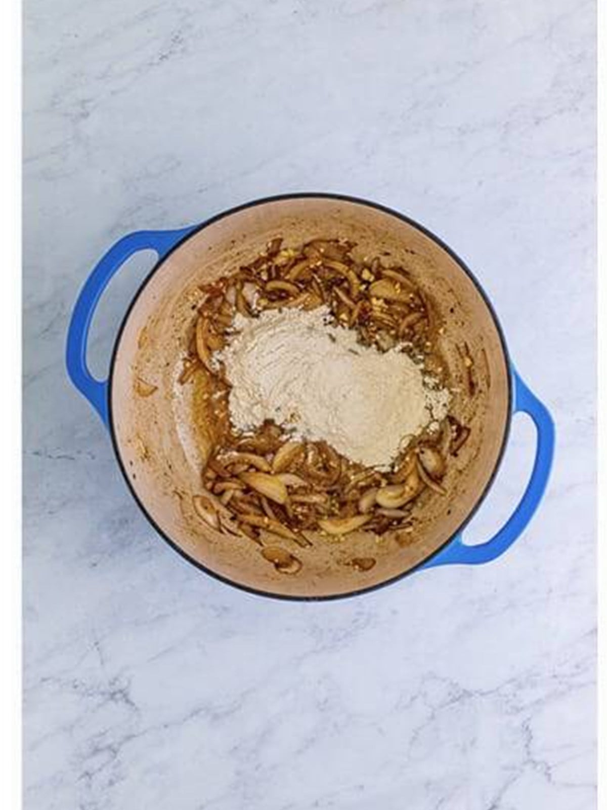Flour added to cooked onions to make a roux for gravy.