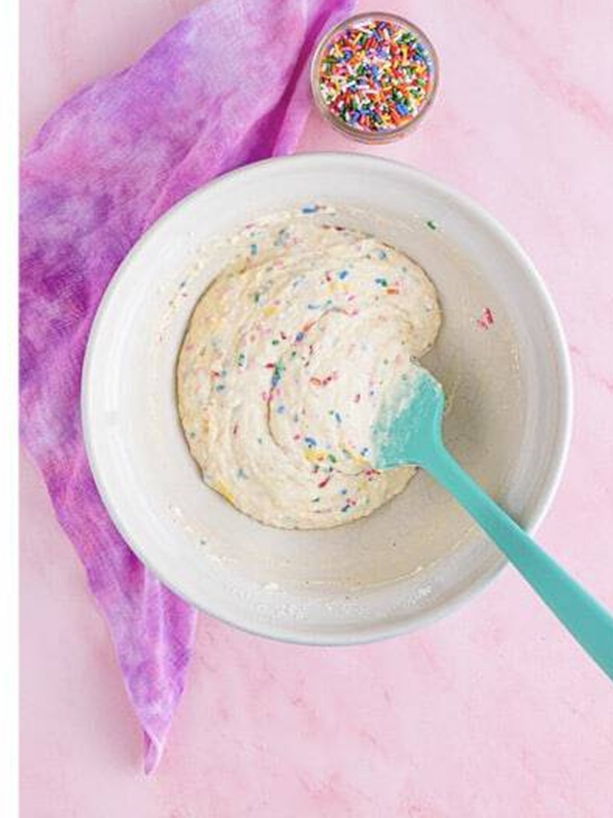 Sprinkles folded into funfetti ice cream bread batter.