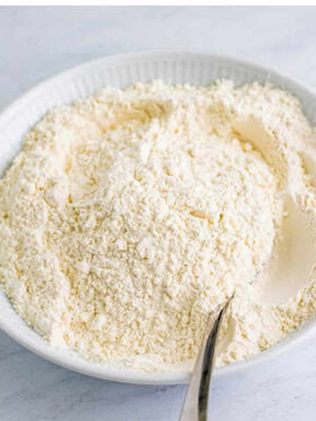 Flour, baking powder, baking soda, and salt whisked together for the cake.