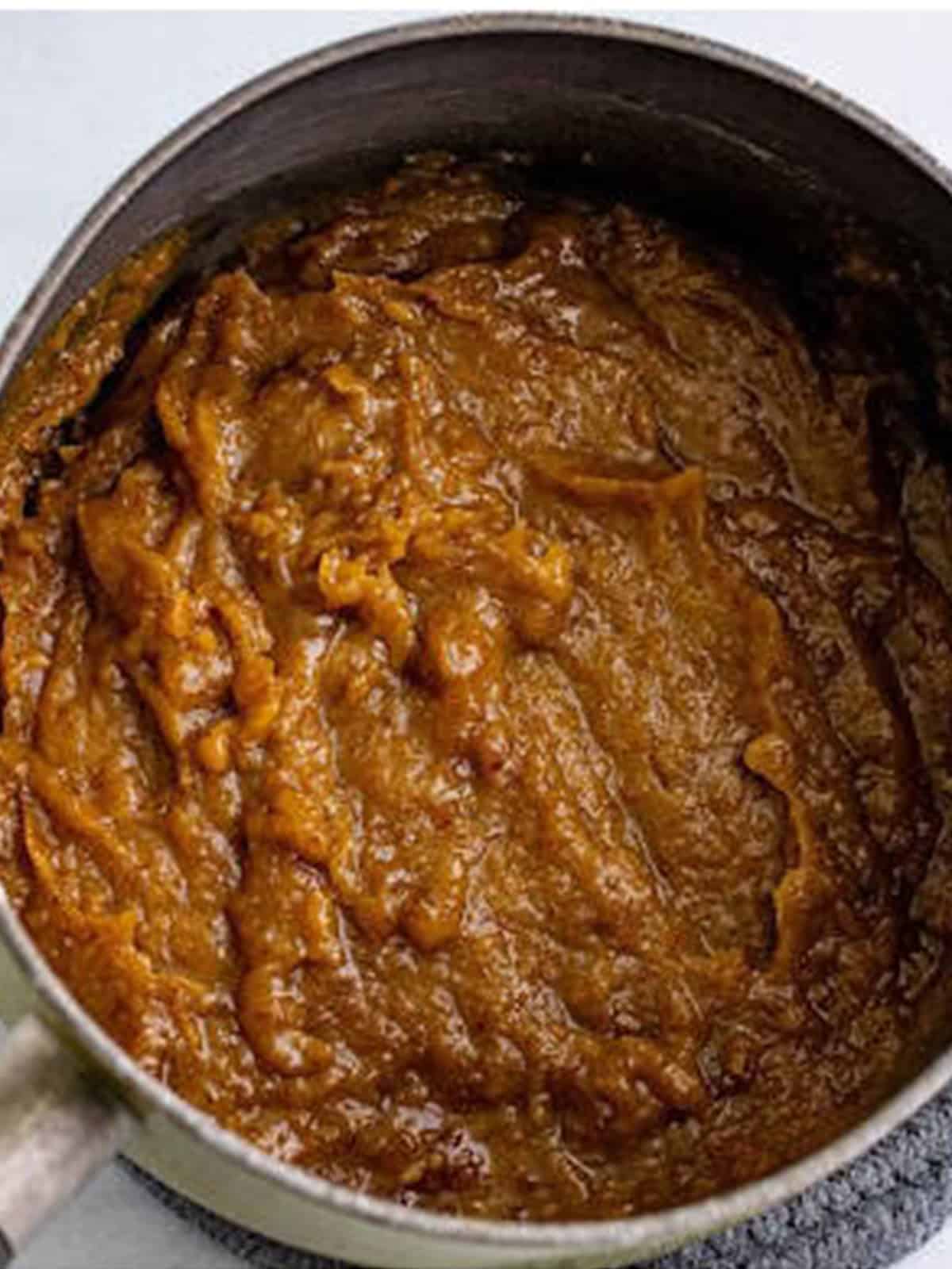 Blended dates stirred into the sticky toffee pudding batter.