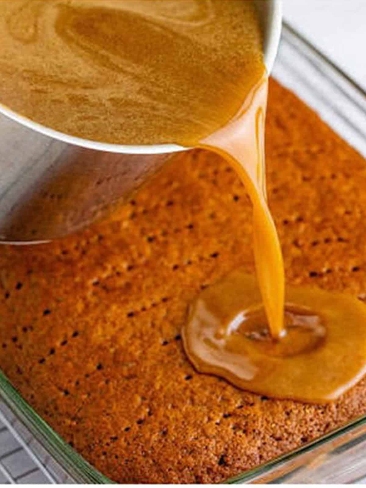 Warm toffee sauce poured over the poked sticky toffee pudding cake.