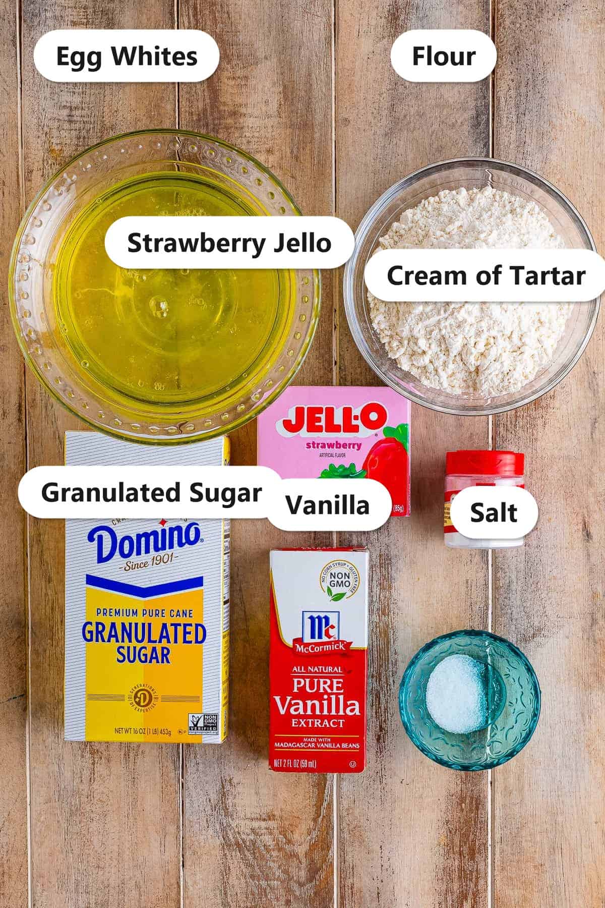 Labeled ingredients for strawberry angel food cake including egg whites, flour, strawberry jello, granulated sugar, cream of tartar, vanilla, and salt.